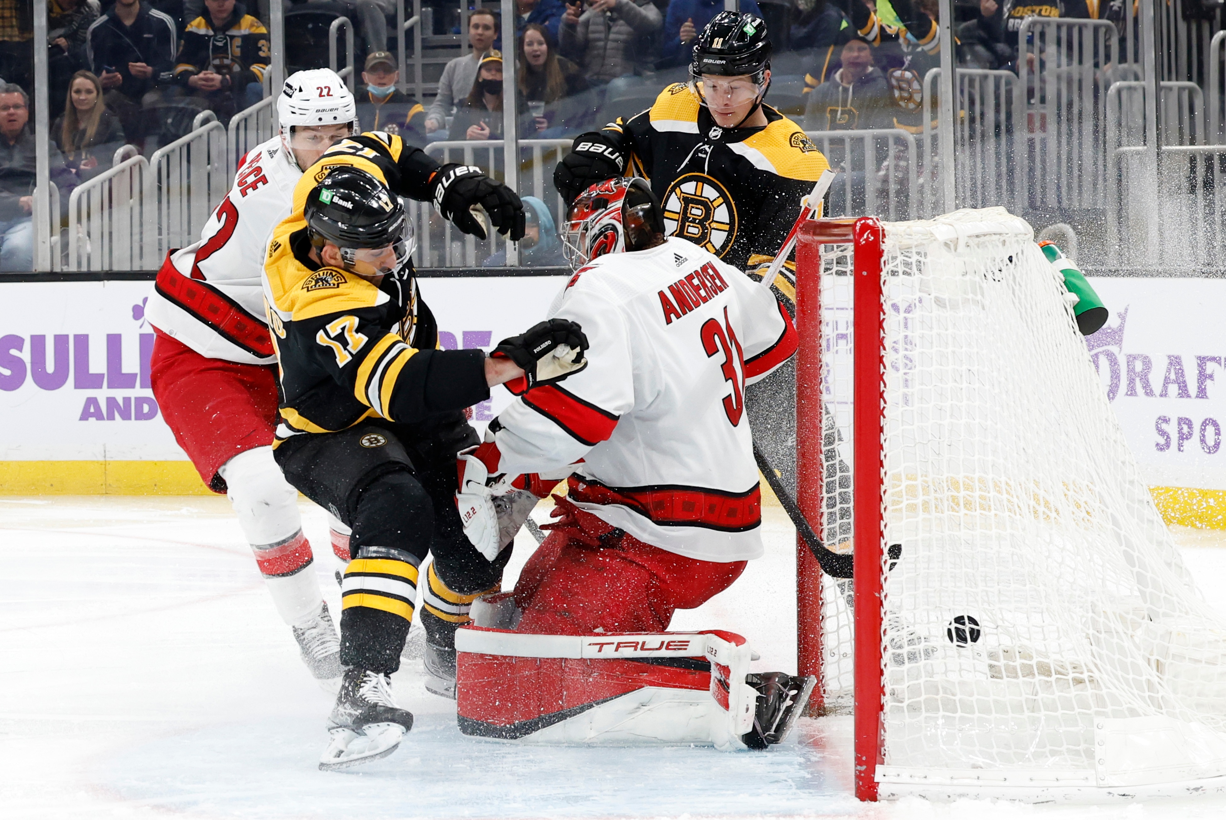 BOSTON, MA - FEBRUARY 10: The puck goes in but Boston Bruins winger Nick Foligno (17) is called for interference on Carolina Hurricanes goalie Frederik Andersen (31) during a game between the Boston Bruins and the Carolina Hurricanes on February 10, 2022 at TD garden in Boston, Massachusetts. (Photo by Fred Kfoury III/Icon Sportswire via Getty Images)