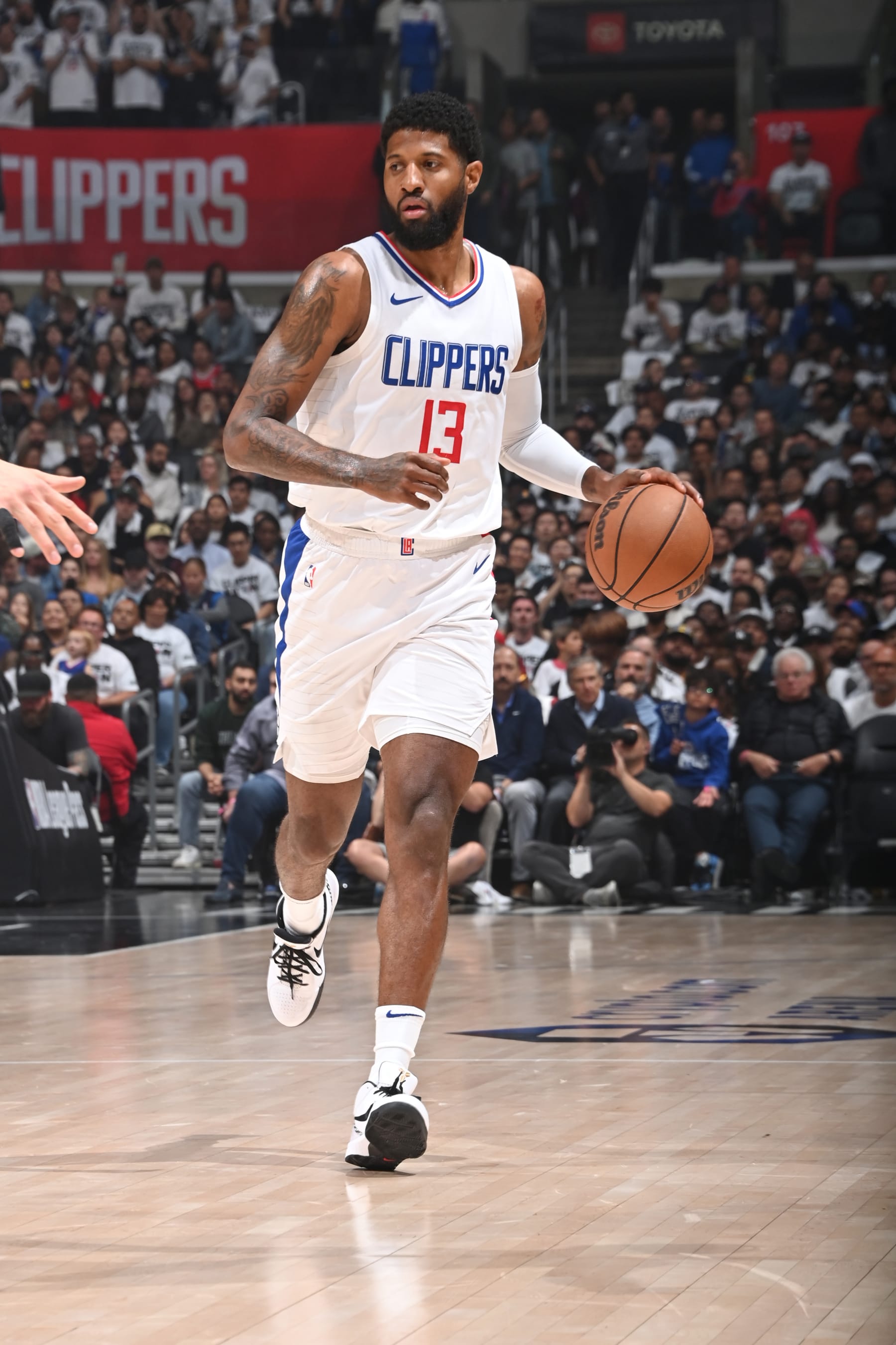 LOS ANGELES, CA - MAY 1:  Paul George #13 of the LA Clippers handles the ball during the game  against the Dallas Mavericks during Round 1 Game 5 of the 2024 NBA Playoffs  on May 1, 2024 at Crypto.Com Arena in Los Angeles, California. NOTE TO USER: User expressly acknowledges and agrees that, by downloading and/or using this Photograph, user is consenting to the terms and conditions of the Getty Images License Agreement. Mandatory Copyright Notice: Copyright 2024 NBAE (Photo by Andrew D. Bernstein/NBAE via Getty Images)