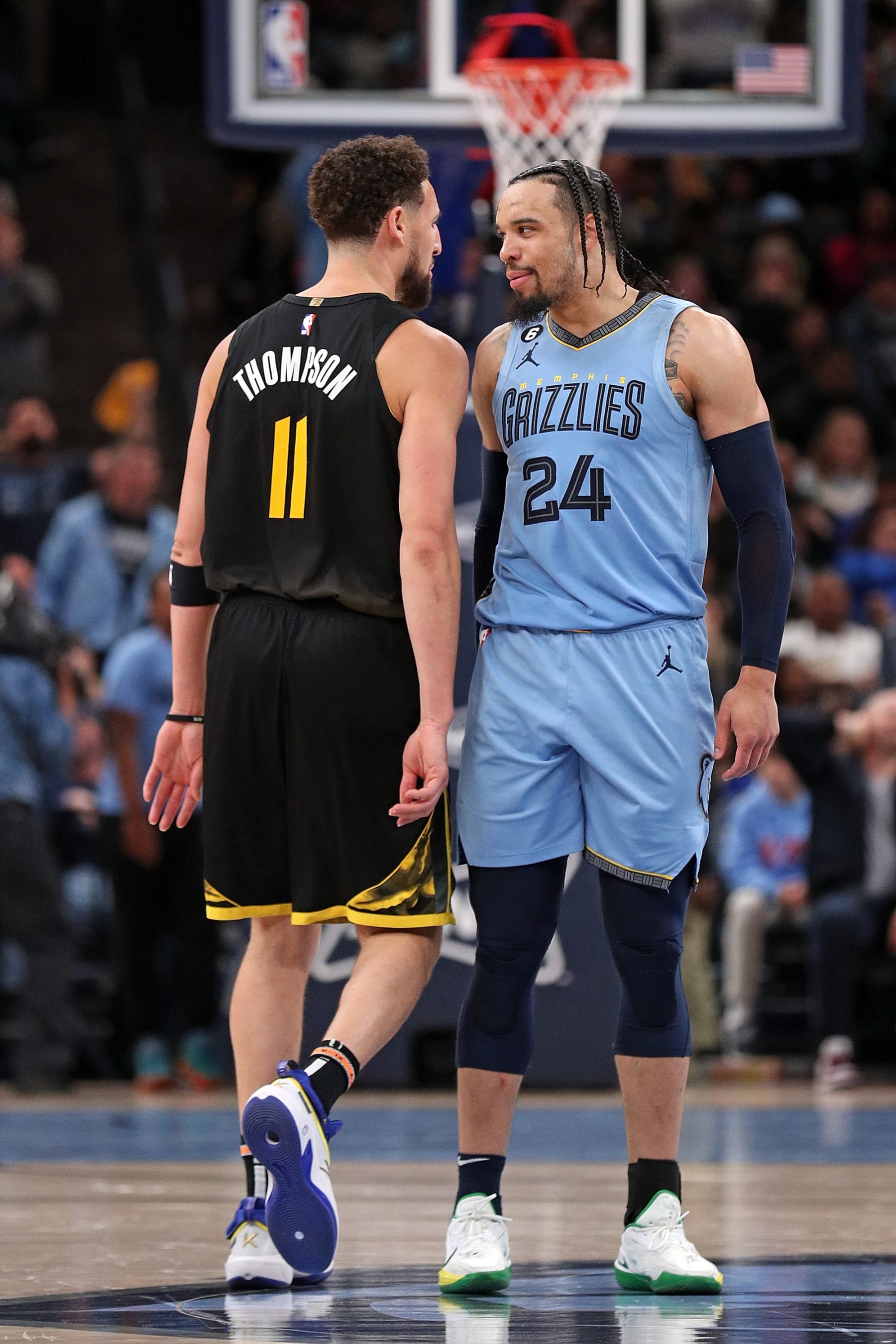 MEMPHIS, TENNESSEE - MARCH 18: Dillon Brooks #24 of the Memphis Grizzlies looks at Klay Thompson #11 of the Golden State Warriors during the second half of the game at FedExForum on March 18, 2023 in Memphis, Tennessee. NOTE TO USER: User expressly acknowledges and agrees that, by downloading and or using this photograph, User is consenting to the terms and conditions of the Getty Images License Agreement. (Photo by Justin Ford/Getty Images)
