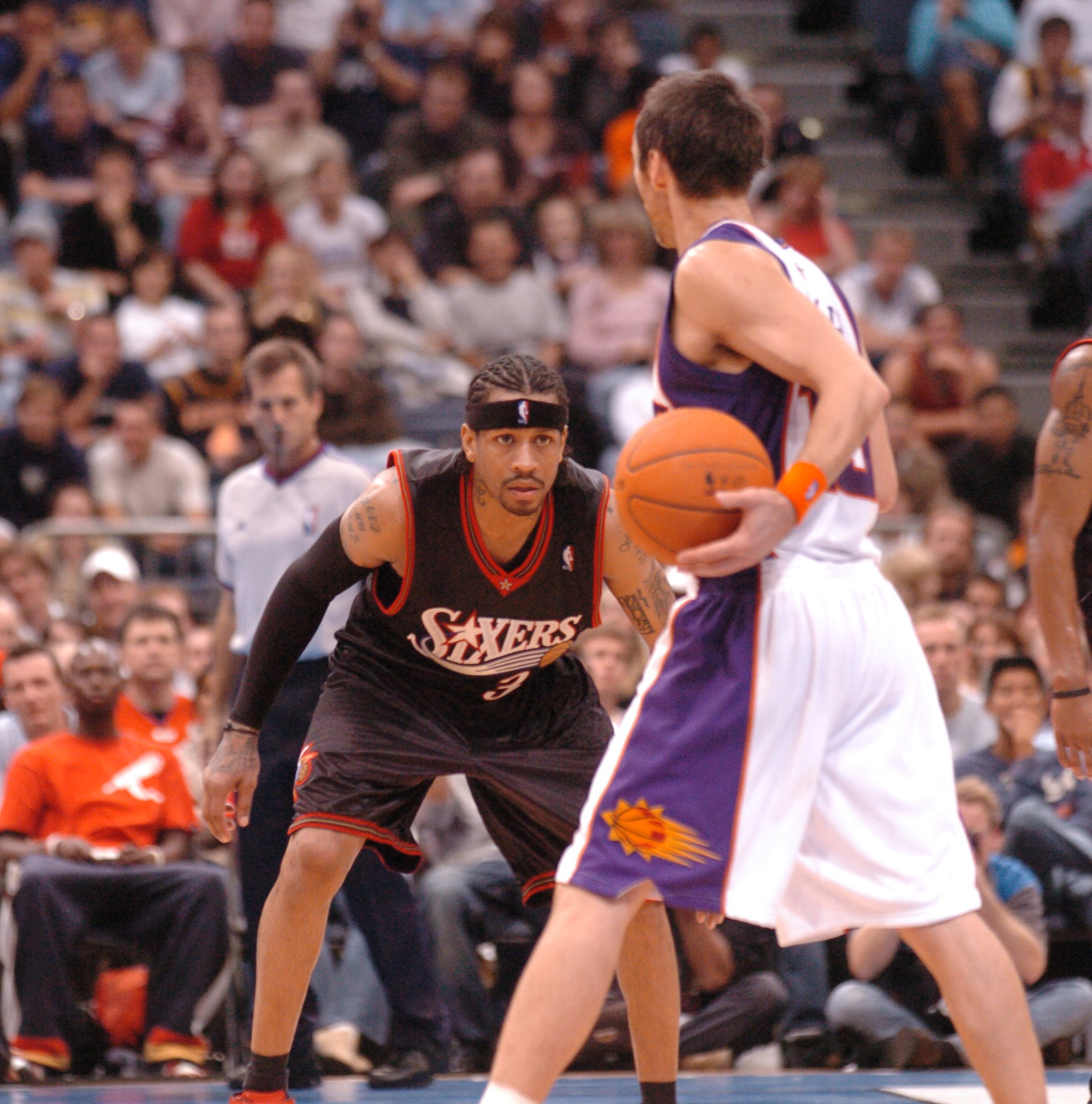Look of concetration on the eyes of Philadelphia's Allen Iverson as he tries to guard Steve Nash of Phoenix during the NBA Europe Live Tour presented by EA Sports at the Koeln Arena in Cologne, Germany, Tuesday, October  10, 2006. (Photo by Mansoor Ahmed/WireImage)