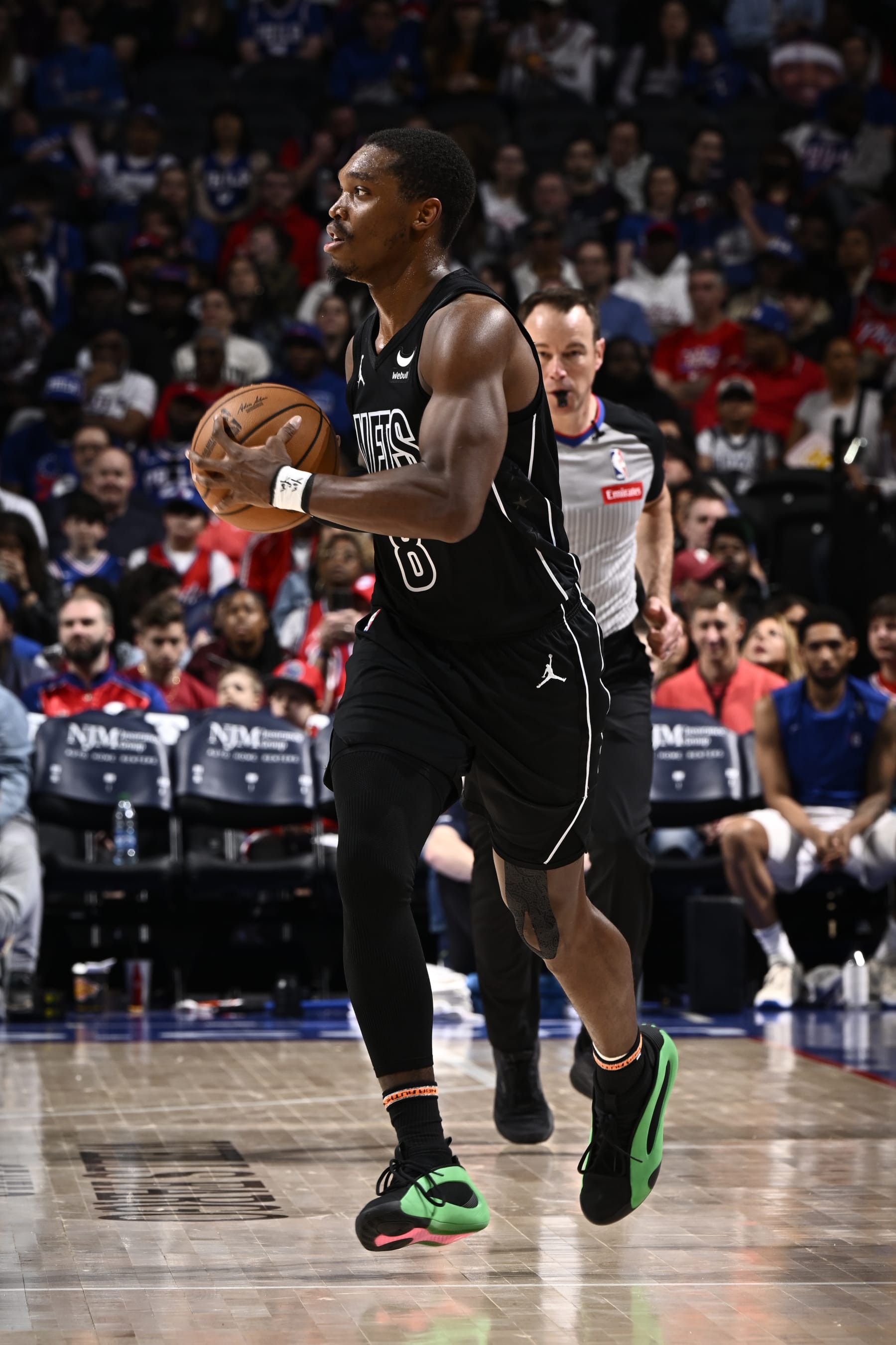 PHILADELPHIA, PA - APRIL 14:  Lonnie Walker IV #8 of the Brooklyn Nets passes the ball during the game against the Philadelphia 76ers on April 14, 2024 at the Wells Fargo Center in Philadelphia, Pennsylvania NOTE TO USER: User expressly acknowledges and agrees that, by downloading and/or using this Photograph, user is consenting to the terms and conditions of the Getty Images License Agreement. Mandatory Copyright Notice: Copyright 2024 NBAE (Photo by David Dow/NBAE via Getty Images)