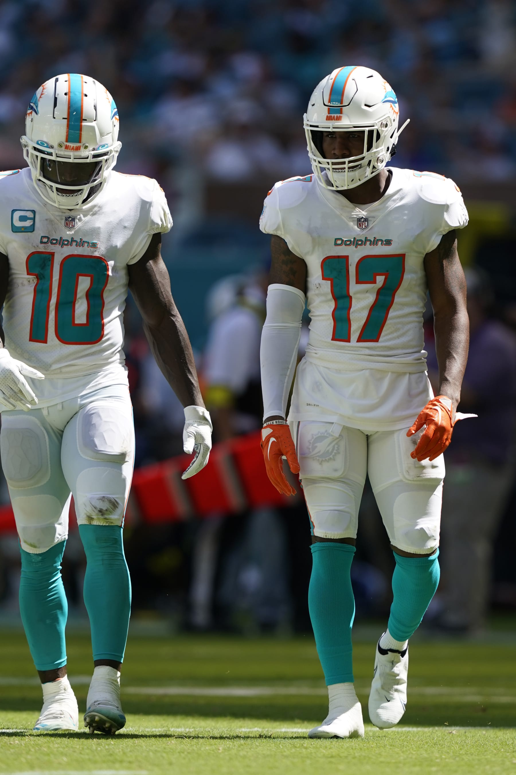 Miami Dolphins wide receivers Jaylen Waddle (17) and Tyreek Hill (10) walk off the field during the second half of an NFL football game against the New England Patriots, Sunday, Sept. 11, 2022, in Miami Gardens, Fla. (AP Photo/Lynne Sladky)
