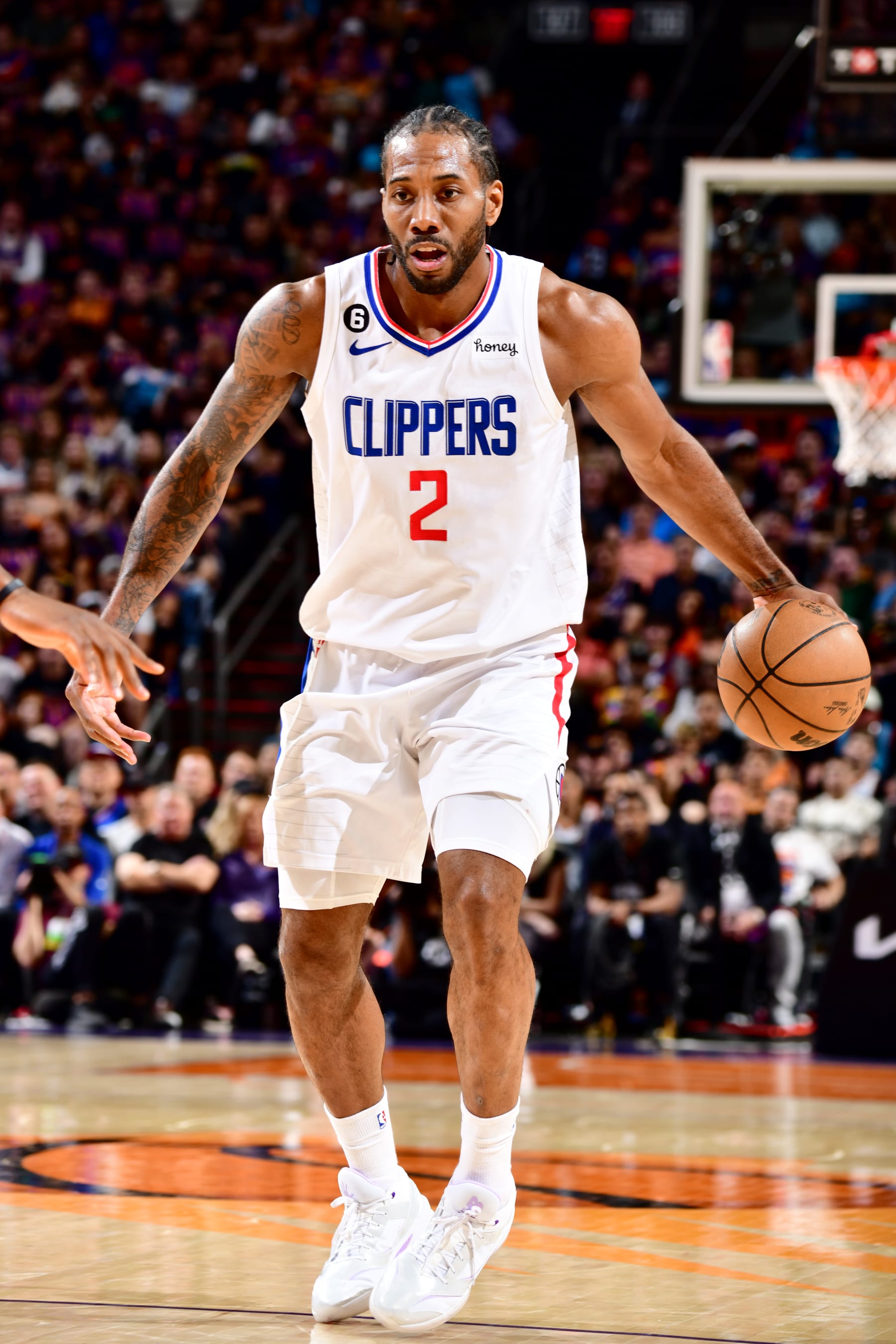 PHOENIX, AZ - APRIL 18: Kawhi Leonard #2 of the LA Clippers dribbles the ball during the game against the Phoenix Suns during Round 1 Game 2 of the 2023 NBA Playoffs on April 18, 2023 at Footprint Center in Phoenix, Arizona. NOTE TO USER: User expressly acknowledges and agrees that, by downloading and or using this photograph, user is consenting to the terms and conditions of the Getty Images License Agreement. Mandatory Copyright Notice: Copyright 2023 NBAE (Photo by Barry Gossage/NBAE via Getty Images)