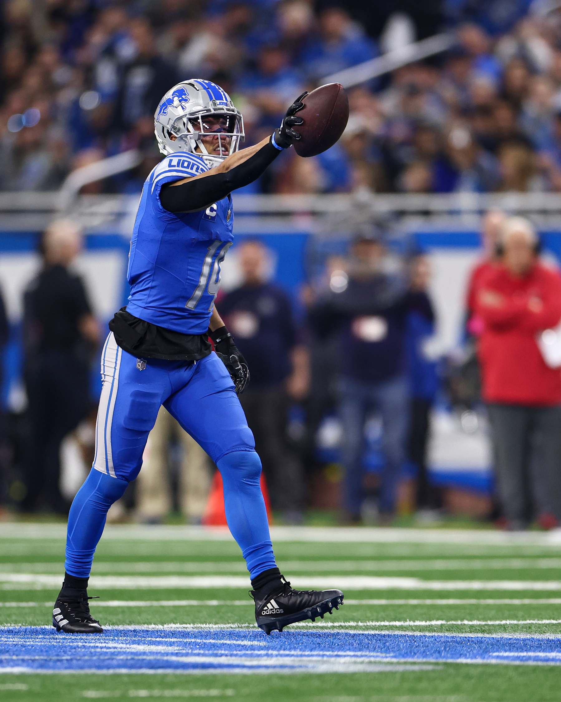 DETROIT, MI - JANUARY 21: Amon-Ra St. Brown #14 of the Detroit Lions celebrates after a play during the first quarter of an NFL divisional round playoff football game against the Tampa Bay Buccaneers at Ford Field on January 21, 2024 in Detroit, Michigan. (Photo by Kevin Sabitus/Getty Images)
