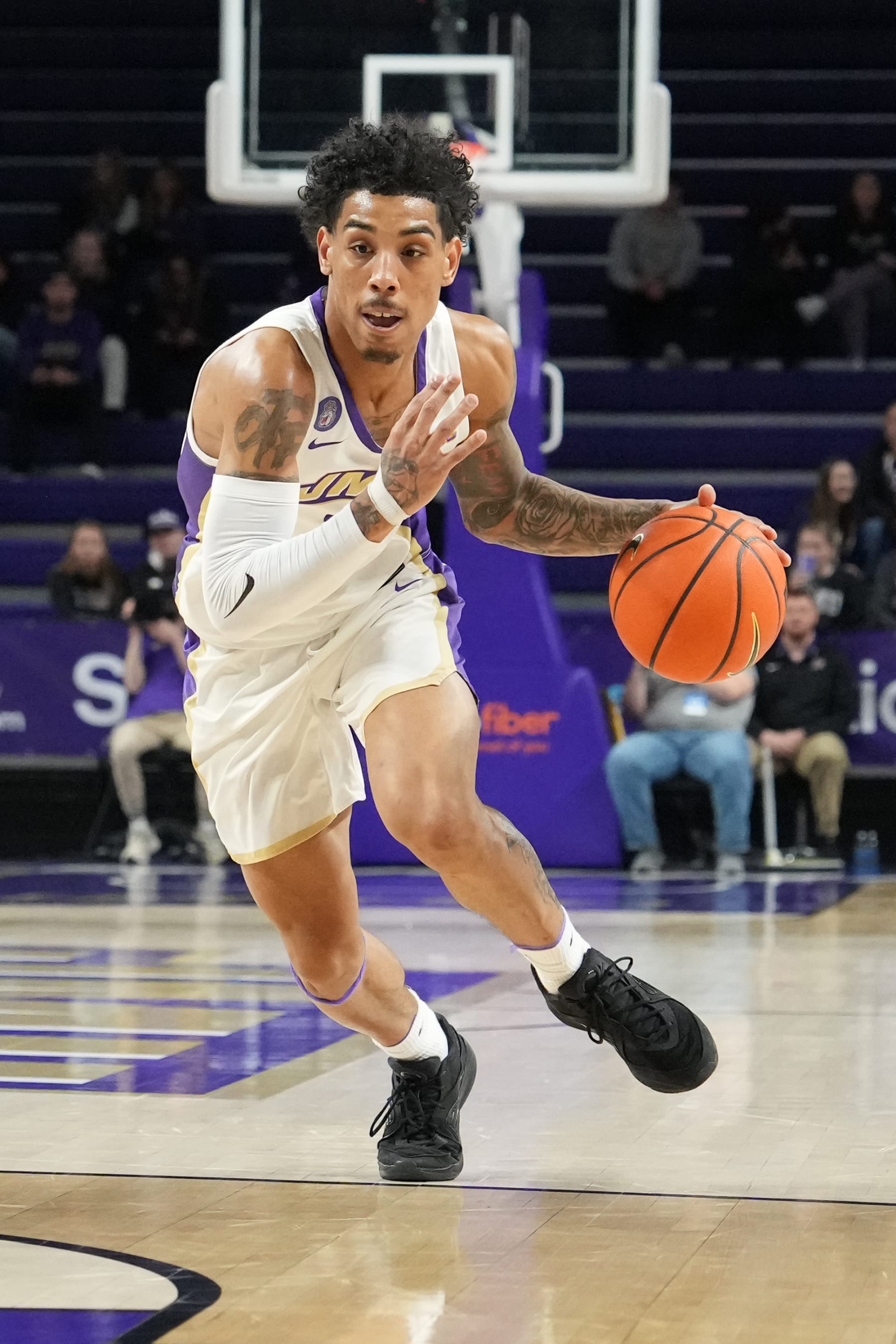 HARRISONBURG, VA - JANUARY 11:  Terrence Edwards Jr. #5 of the James Madison Dukes dribbles the ball during a college basketball game against the South Alabama Jaguars at the Atlantic Union Bank Center on January 11, 2024 in Harrisonburg, Virginia.  (Photo by Mitchell Layton/Getty Images)