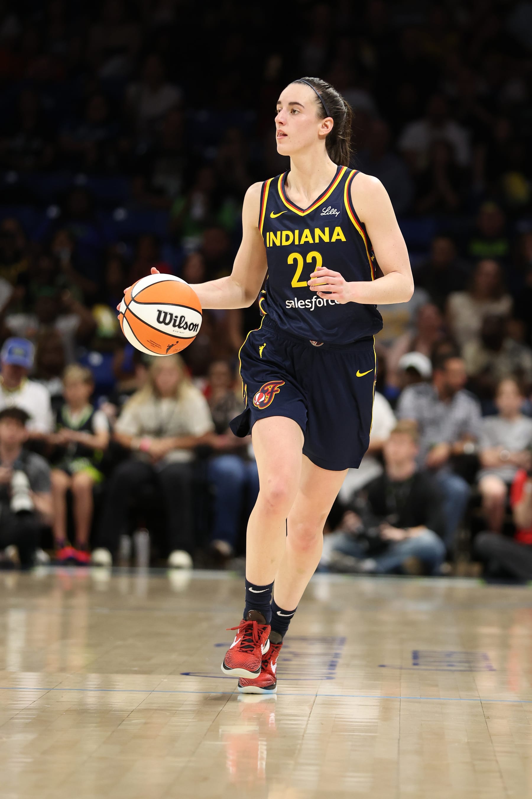 ARLINGTON, TEXAS - MAY 03: Caitlin Clark #22 of the Indiana Fever brings the ball up the court in the first half against the Dallas Wings at College Park Center on May 03, 2024 in Arlington, Texas.  (Photo by Gregory Shamus/Getty Images)