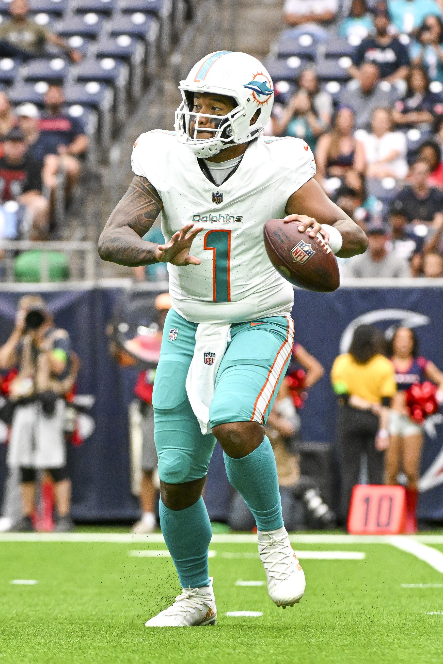 HOUSTON, TEXAS - AUGUST 19: Tua Tagovailoa #1 of the Miami Dolphins drops back to pass in the preseason game against the Houston Texans at NRG Stadium on August 19, 2023 in Houston, Texas. (Photo by Logan Riely/Getty Images)