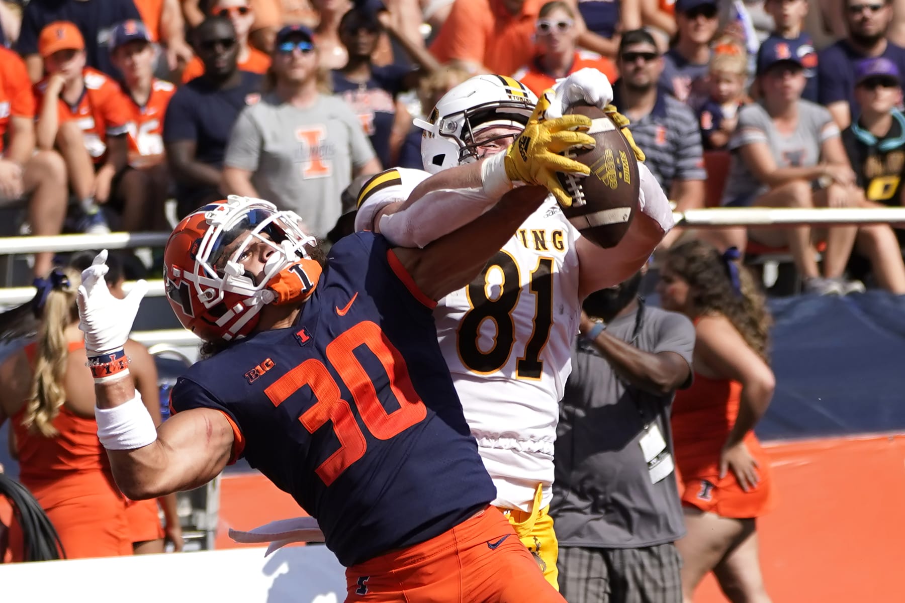 Illinois defensive back Sydney Brown (30) breaks up a pass intended for Wyoming tight end Treyton Welch in the end zone during an NCAA college football game, Sunday, Aug. 28, 2022, in Champaign, Ill. (AP Photo/Charles Rex Arbogast)