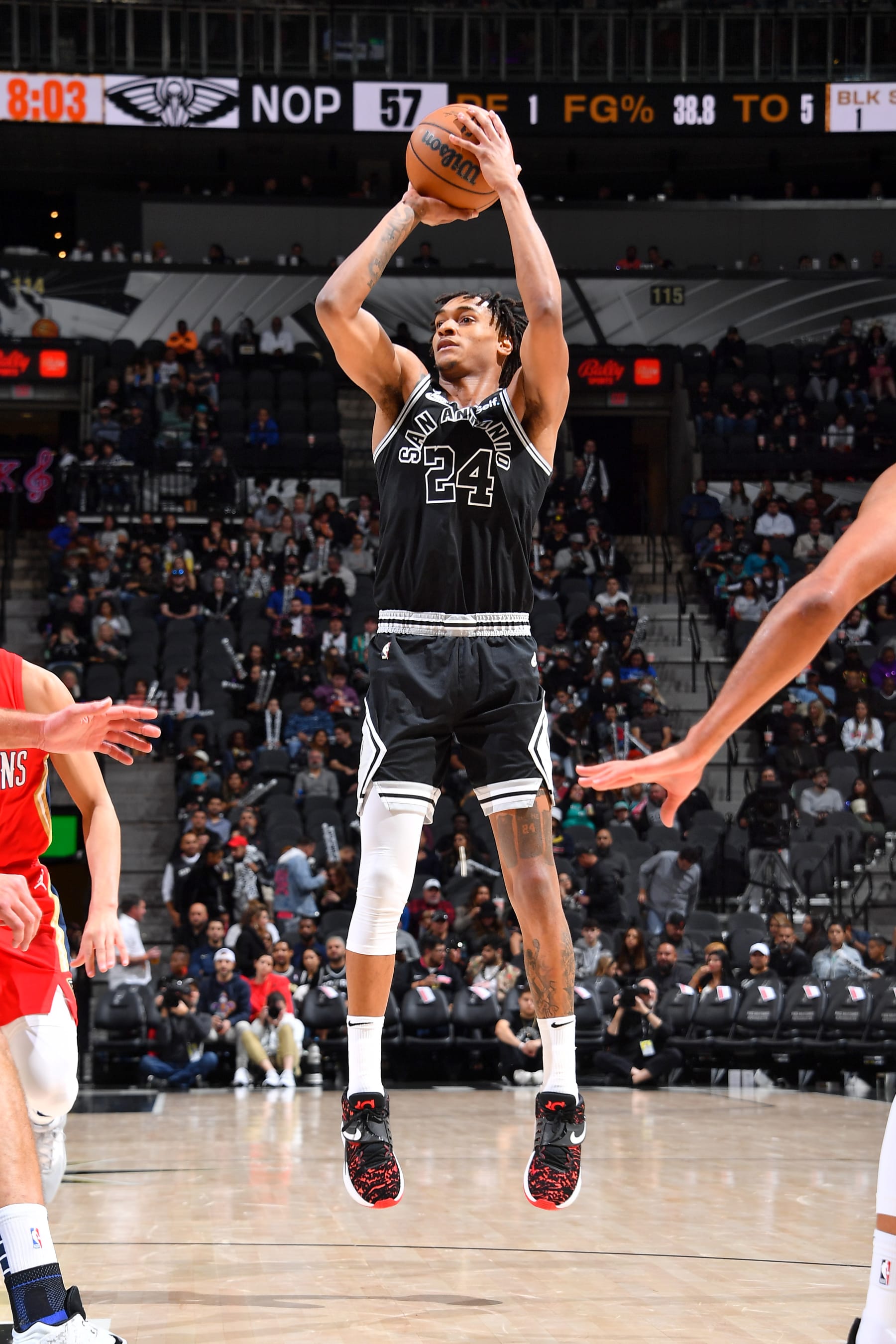SAN ANTONIO, TX - DECEMBER 2: Devin Vassell #24 of the San Antonio Spurs shoots the ball during the game against the New Orleans Pelicans on December 2, 2022 at the AT&T Center in San Antonio, Texas. NOTE TO USER: User expressly acknowledges and agrees that, by downloading and or using this photograph, user is consenting to the terms and conditions of the Getty Images License Agreement. Mandatory Copyright Notice: Copyright 2022 NBAE (Photos by Michael Gonzales/NBAE via Getty Images)