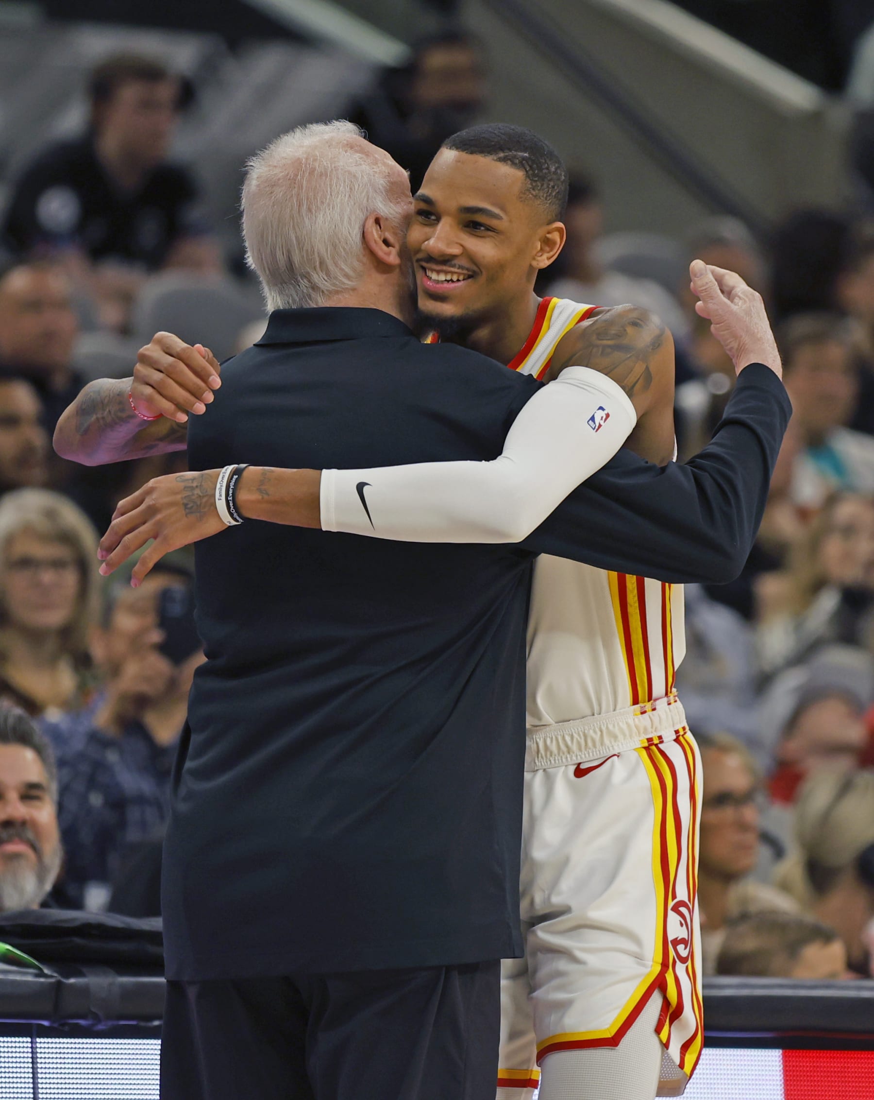 SAN ANTONIO, TX - MARCH 19:  Head coach Gregg Popovich of the San Antonio Spurs greets Dejounte Murray #5 of the Atlanta Hawks before the game at AT&T Center on March 19, 2023 in San Antonio, Texas. NOTE TO USER: User expressly acknowledges and agrees that, by downloading and or using this photograph, User is consenting to terms and conditions of the Getty Images License Agreement. (Photo by Ronald Cortes/Getty Images)
