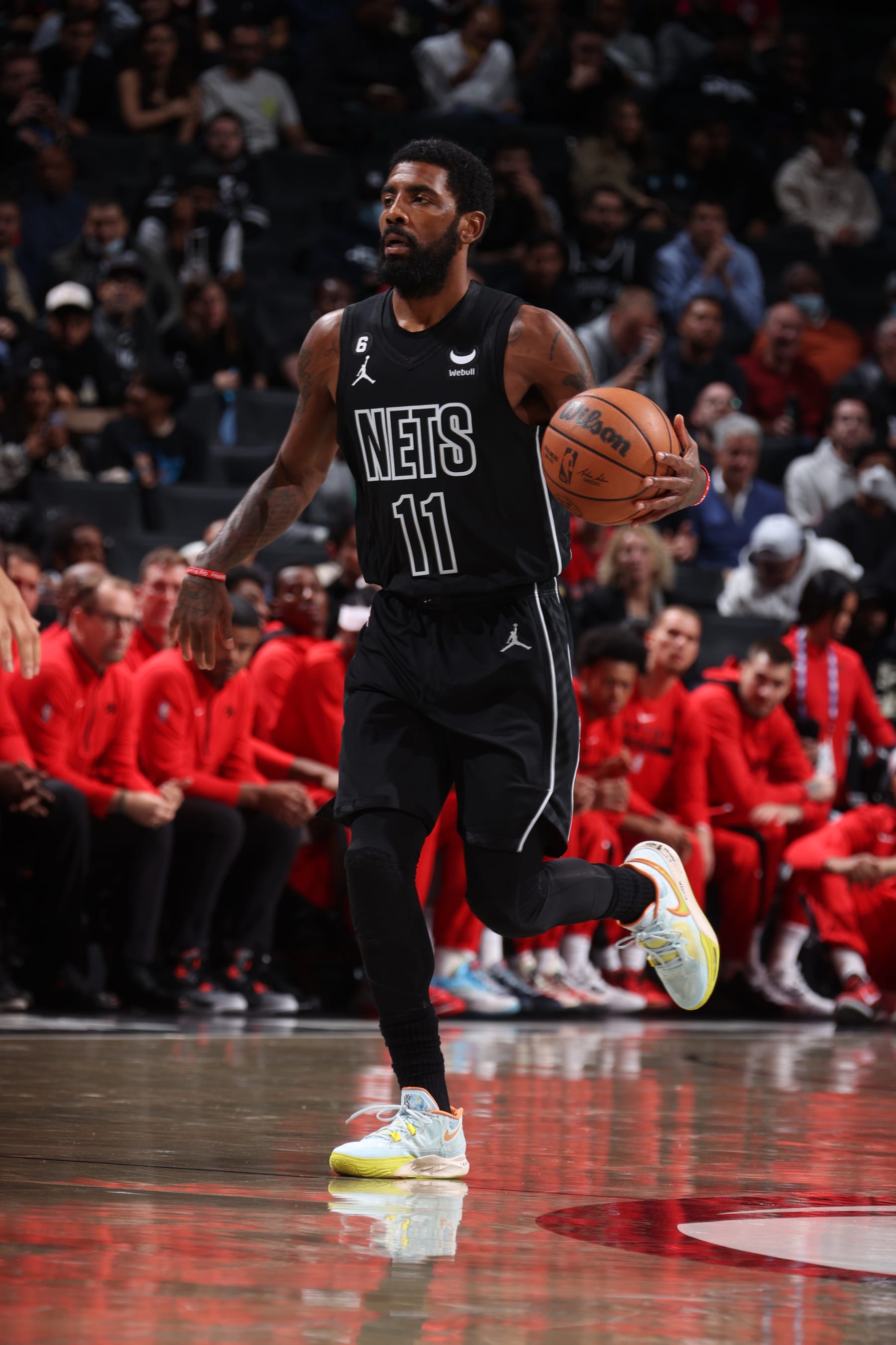 BROOKLYN, NY - OCTOBER 21: Kyrie Irving #11 of the Brooklyn Nets dribbles the ball during the game against the Toronto Raptors on October 21, 2022 at Barclays Center in Brooklyn, New York. NOTE TO USER: User expressly acknowledges and agrees that, by downloading and or using this Photograph, user is consenting to the terms and conditions of the Getty Images License Agreement. Mandatory Copyright Notice: Copyright 2022 NBAE (Photo by Nathaniel S. Butler/NBAE via Getty Images)