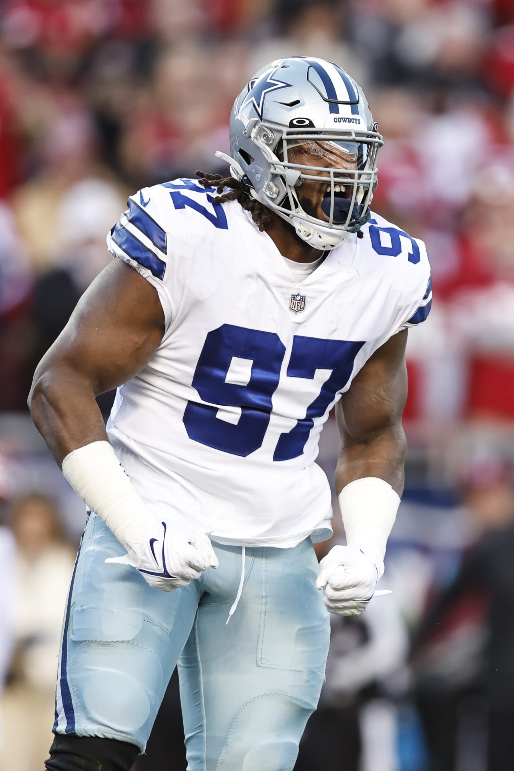 SANTA CLARA, CALIFORNIA - JANUARY 22: Osa Odighizuwa #97 of the Dallas Cowboys reacts after making a sack during an NFL divisional round playoff football game between the San Francisco 49ers and the Dallas Cowboys at Levi's Stadium on January 22, 2023 in Santa Clara, California. (Photo by Michael Owens/Getty Images)