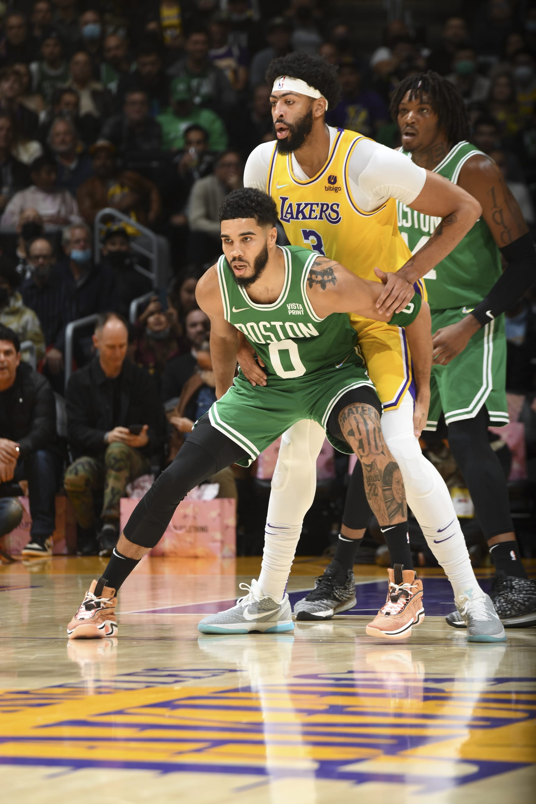 LOS ANGELES, CA - DECEMBER 7: Jayson Tatum #0 of the Boston Celtics and Anthony Davis #3 of the Los Angeles Lakers fight for position during the game on December 7, 2021 at STAPLES Center in Los Angeles, California. NOTE TO USER: User expressly acknowledges and agrees that, by downloading and/or using this Photograph, user is consenting to the terms and conditions of the Getty Images License Agreement. Mandatory Copyright Notice: Copyright 2021 NBAE (Photo by Andrew D. Bernstein/NBAE via Getty Images)