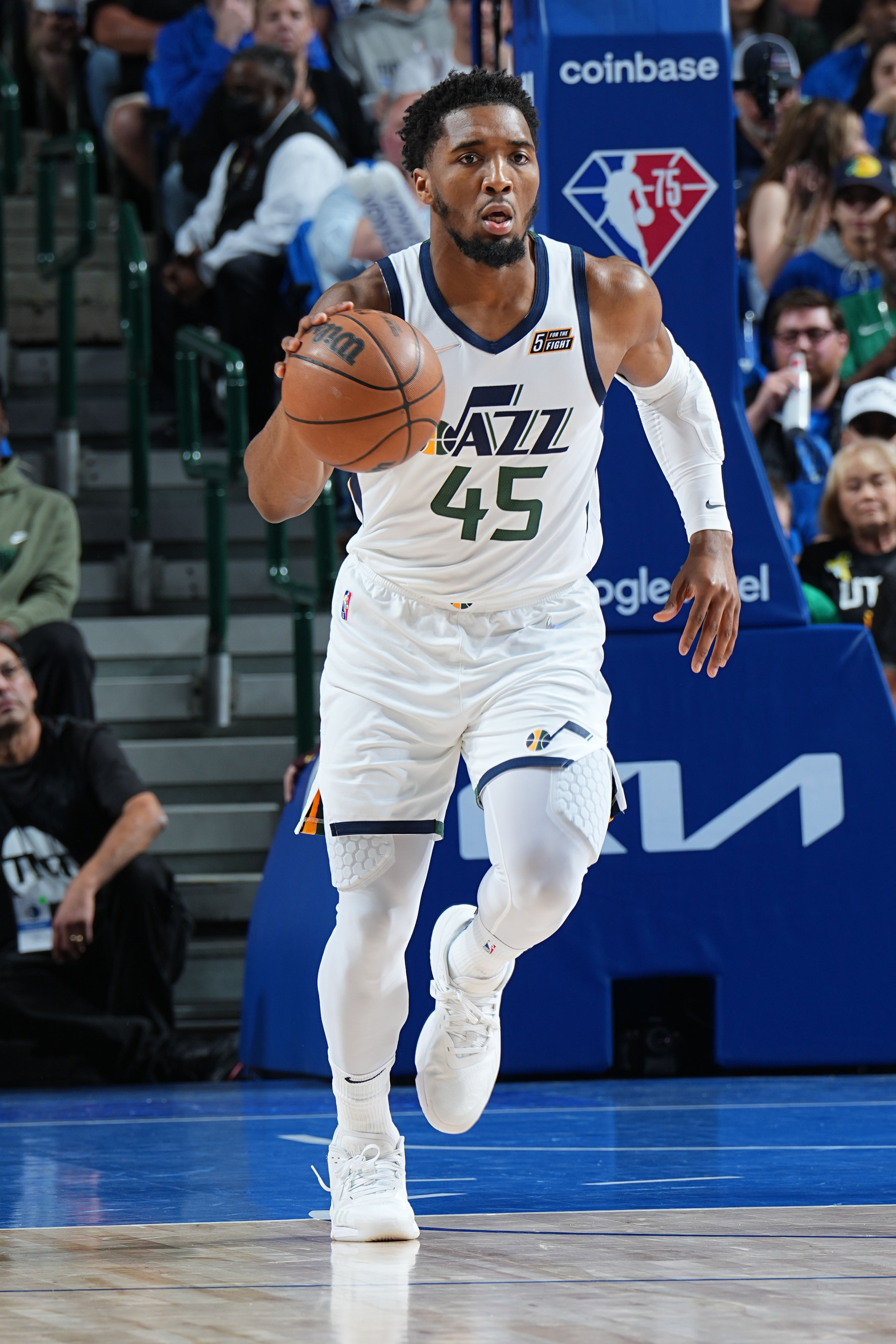 DALLAS, TX - APRIL 25: Donovan Mitchell #45 of the Utah Jazz dribbles the ball during Round 1 Game 5 of the 2022 NBA Playoffs against the Dallas Mavericks on April 25, 2022 at the American Airlines Center in Dallas, Texas. NOTE TO USER: User expressly acknowledges and agrees that, by downloading and or using this photograph, User is consenting to the terms and conditions of the Getty Images License Agreement. Mandatory Copyright Notice: Copyright 2022 NBAE (Photo by Glenn James/NBAE via Getty Images)