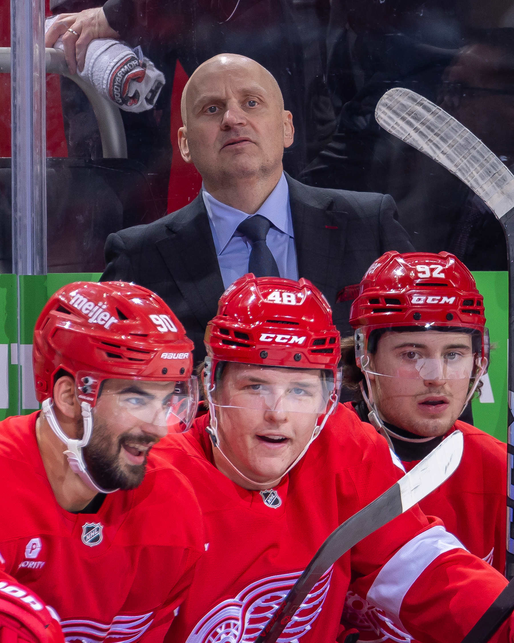 DETROIT, MICHIGAN - DECEMBER 01: Head coach Derek Lalonde of the Detroit Red Wings  watches the action from the bench against the Vancouver Canucks during the first period at Little Caesars Arena on December 1, 2024 in Detroit, Michigan. (Photo by Dave Reginek/NHLI via Getty Images)