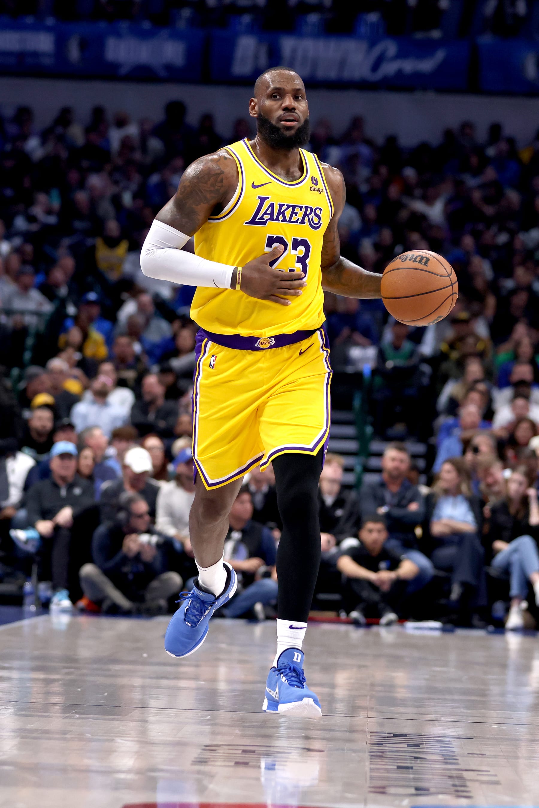 DALLAS, TEXAS - DECEMBER 12: LeBron James #23 of the Los Angeles Lakers dribbles up court against the Dallas Mavericks in the first half at American Airlines Center on December 12, 2023 in Dallas, Texas. NOTE TO USER: User expressly acknowledges and agrees that, by downloading and or using this photograph, User is consenting to the terms and conditions of the Getty Images License Agreement. (Photo by Tim Heitman/Getty Images)