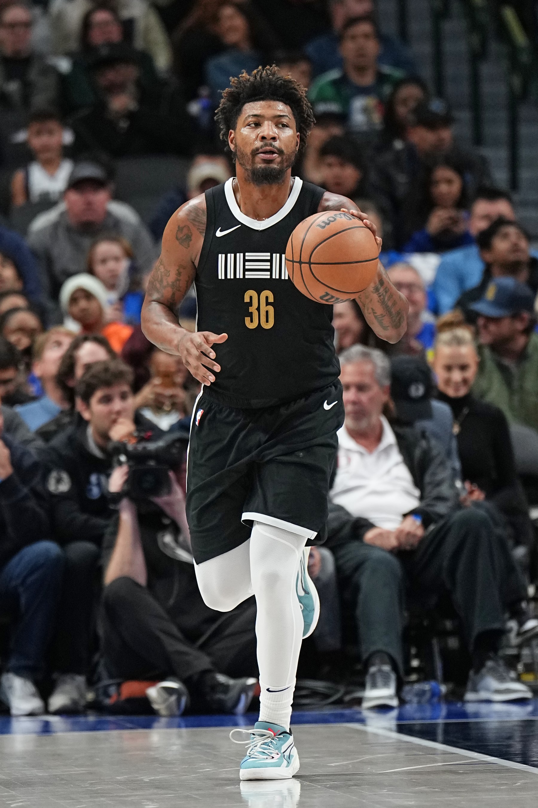 DALLAS, TX - JANUARY 9: Marcus Smart #36 of the Memphis Grizzlies dribbles the ball during the game against the Dallas Mavericks on January 9, 2024 at the American Airlines Center in Dallas, Texas. NOTE TO USER: User expressly acknowledges and agrees that, by downloading and or using this photograph, User is consenting to the terms and conditions of the Getty Images License Agreement. Mandatory Copyright Notice: Copyright 2024 NBAE (Photo by Glenn James/NBAE via Getty Images)