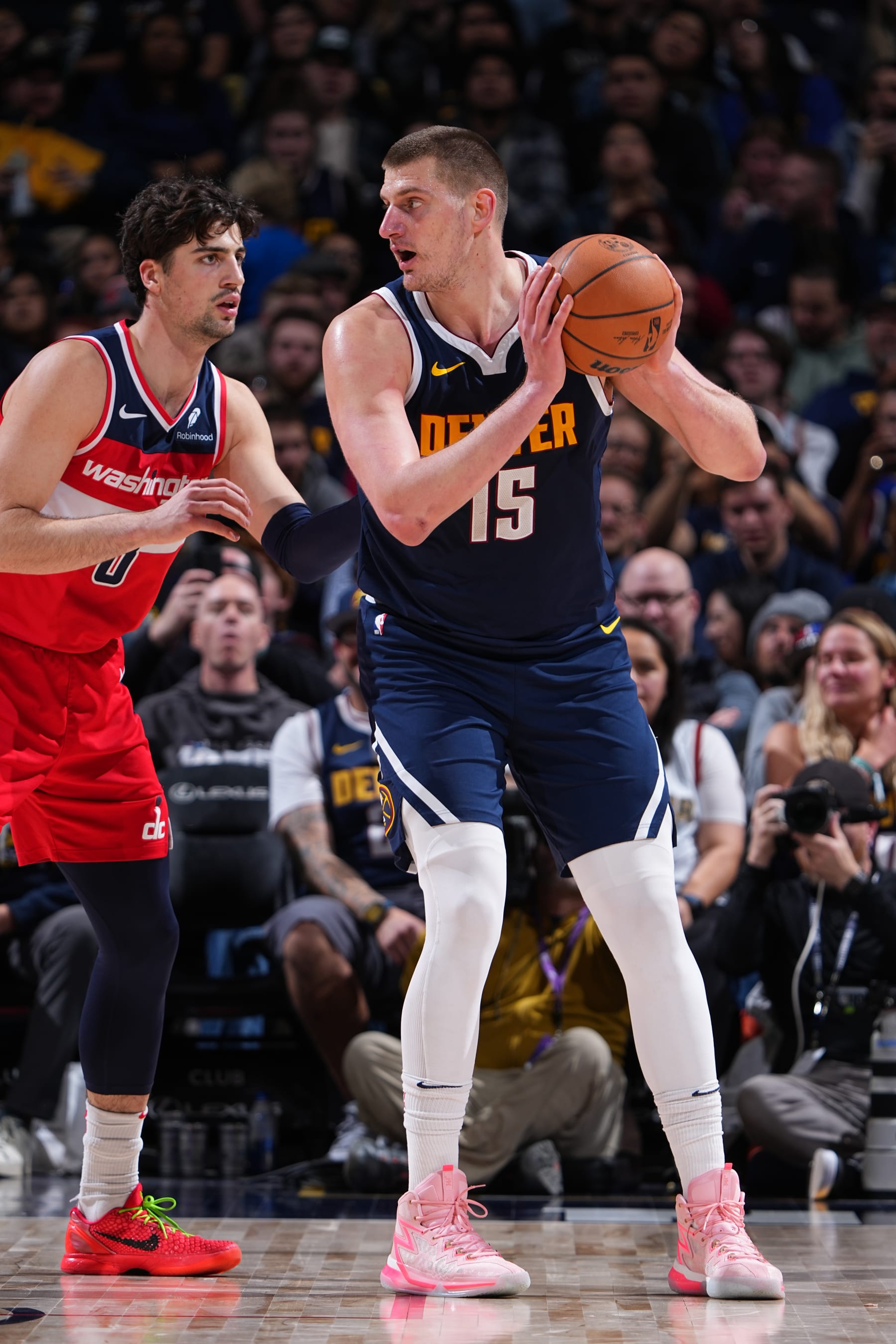 DENVER, CO - FEBRUARY 22: Nikola Jokic #15 of the Denver Nuggets handles the ball during the game against the Washington Wizards on February 22, 2024 at the Ball Arena in Denver, Colorado. NOTE TO USER: User expressly acknowledges and agrees that, by downloading and/or using this Photograph, user is consenting to the terms and conditions of the Getty Images License Agreement. Mandatory Copyright Notice: Copyright 2024 NBAE (Photo by Garrett Ellwood/NBAE via Getty Images)