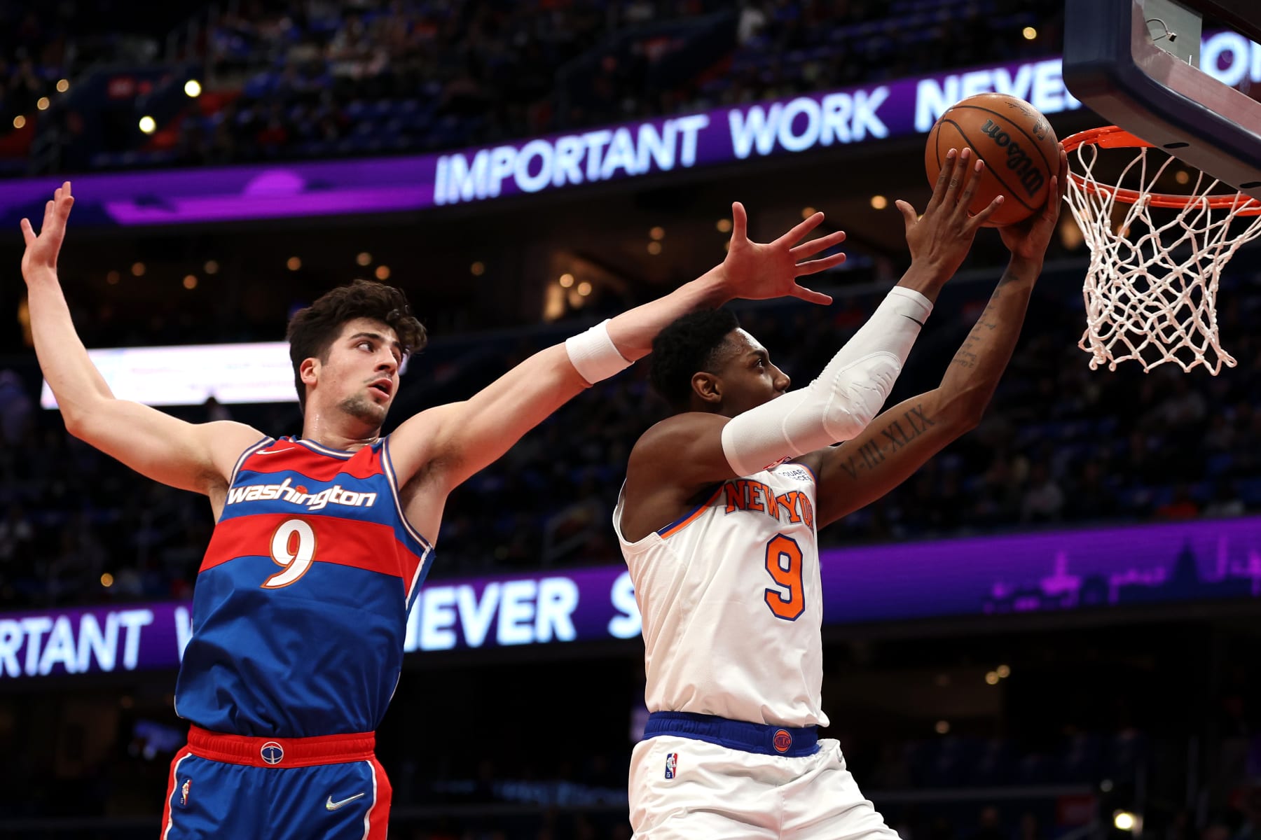 WASHINGTON, DC - APRIL 08: RJ Barrett #9 of the New York Knicks shoots in front of Deni Avdija #9 of the Washington Wizards during the first half at Capital One Arena on April 08, 2022 in Washington, DC. NOTE TO USER: User expressly acknowledges and agrees that, by downloading and or using this photograph, User is consenting to the terms and conditions of the Getty Images License Agreement. (Photo by Patrick Smith/Getty Images)