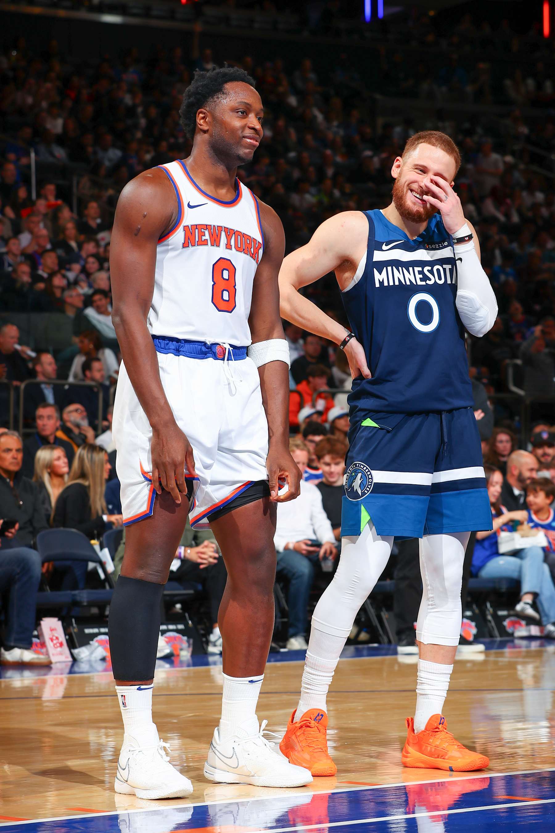 NEW YORK, NY - OCTOBER 13: OG Anunoby #8 of the New York Knicks speaks with Donte DiVincenzo #0 of the Minnesota Timberwolves during the game on October 13, 2024 at Madison Square Garden in New York City, New York.  NOTE TO USER: User expressly acknowledges and agrees that, by downloading and or using this photograph, User is consenting to the terms and conditions of the Getty Images License Agreement. Mandatory Copyright Notice: Copyright 2024 NBAE  (Photo by David L. Nemec/NBAE via Getty Images)