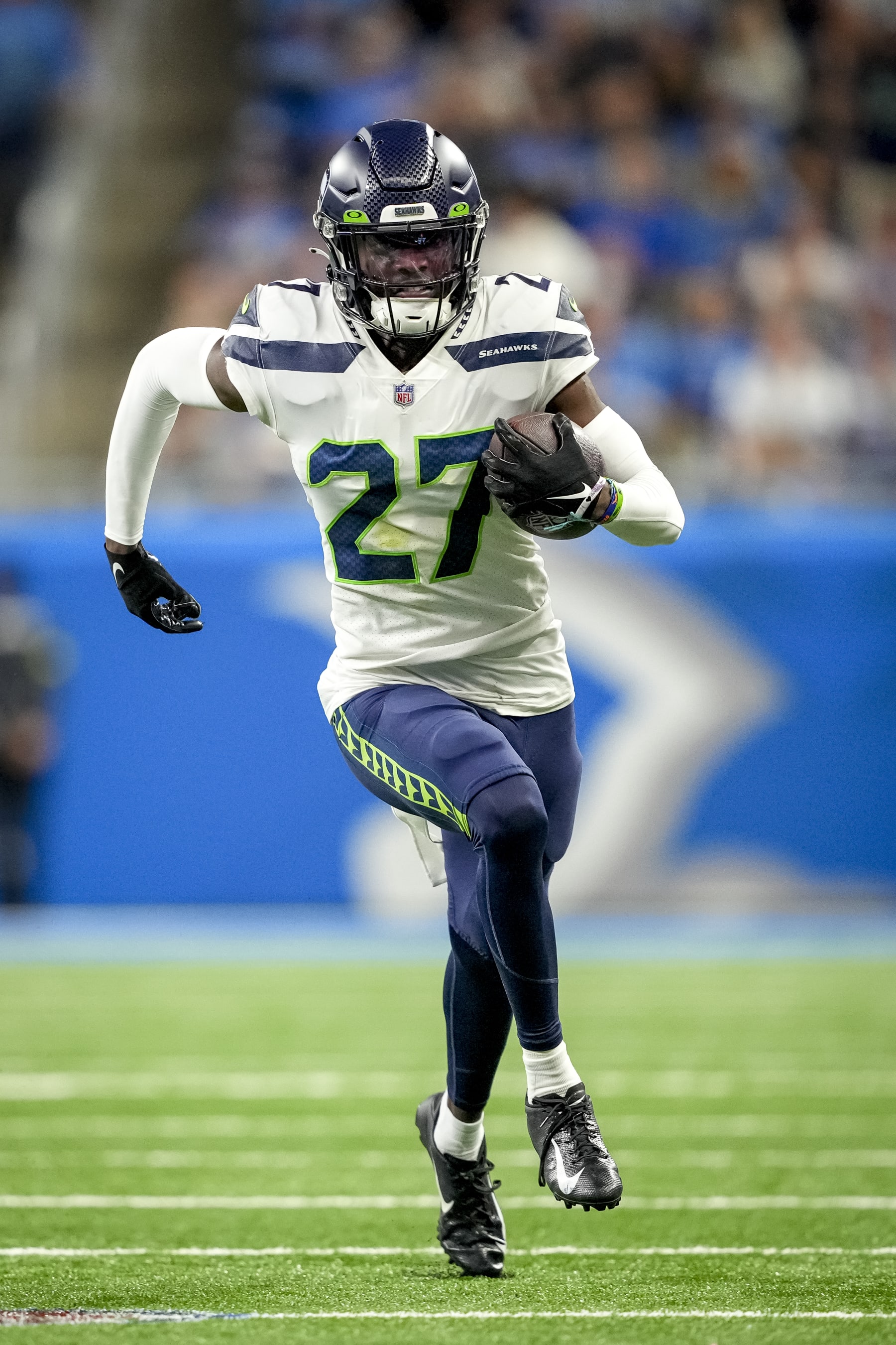 DETROIT, MICHIGAN - OCTOBER 02: Tariq Woolen #27 of the Seattle Seahawks runs the ball after an interception during the third quarter of the game against the Detroit Lions at Ford Field on October 02, 2022 in Detroit, Michigan. (Photo by Nic Antaya/Getty Images)