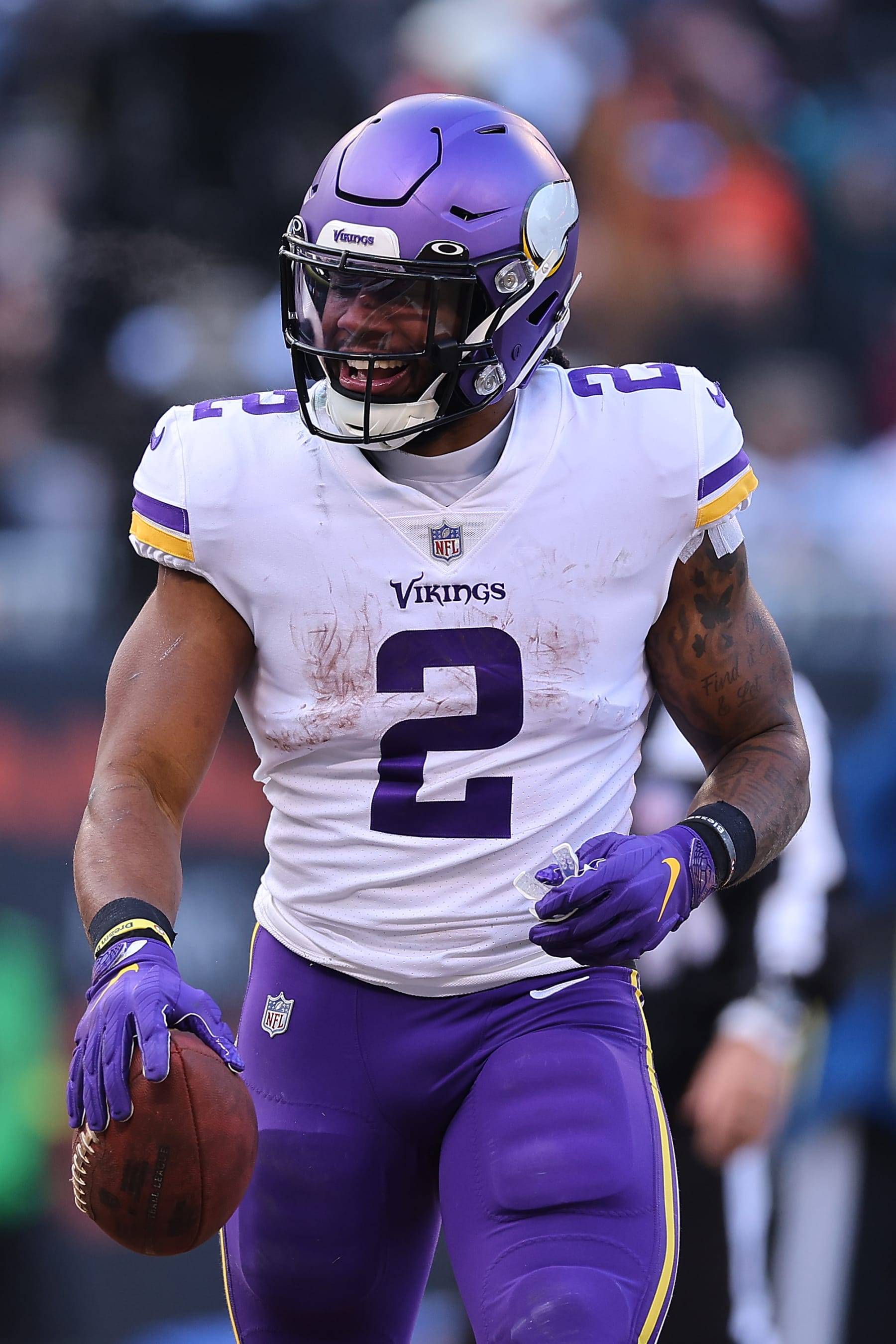 CHICAGO, ILLINOIS - JANUARY 08: Alexander Mattison #2 of the Minnesota Vikings celebrates after scoring a touchdown against the Chicago Bears at Soldier Field on January 08, 2023 in Chicago, Illinois. (Photo by Michael Reaves/Getty Images)