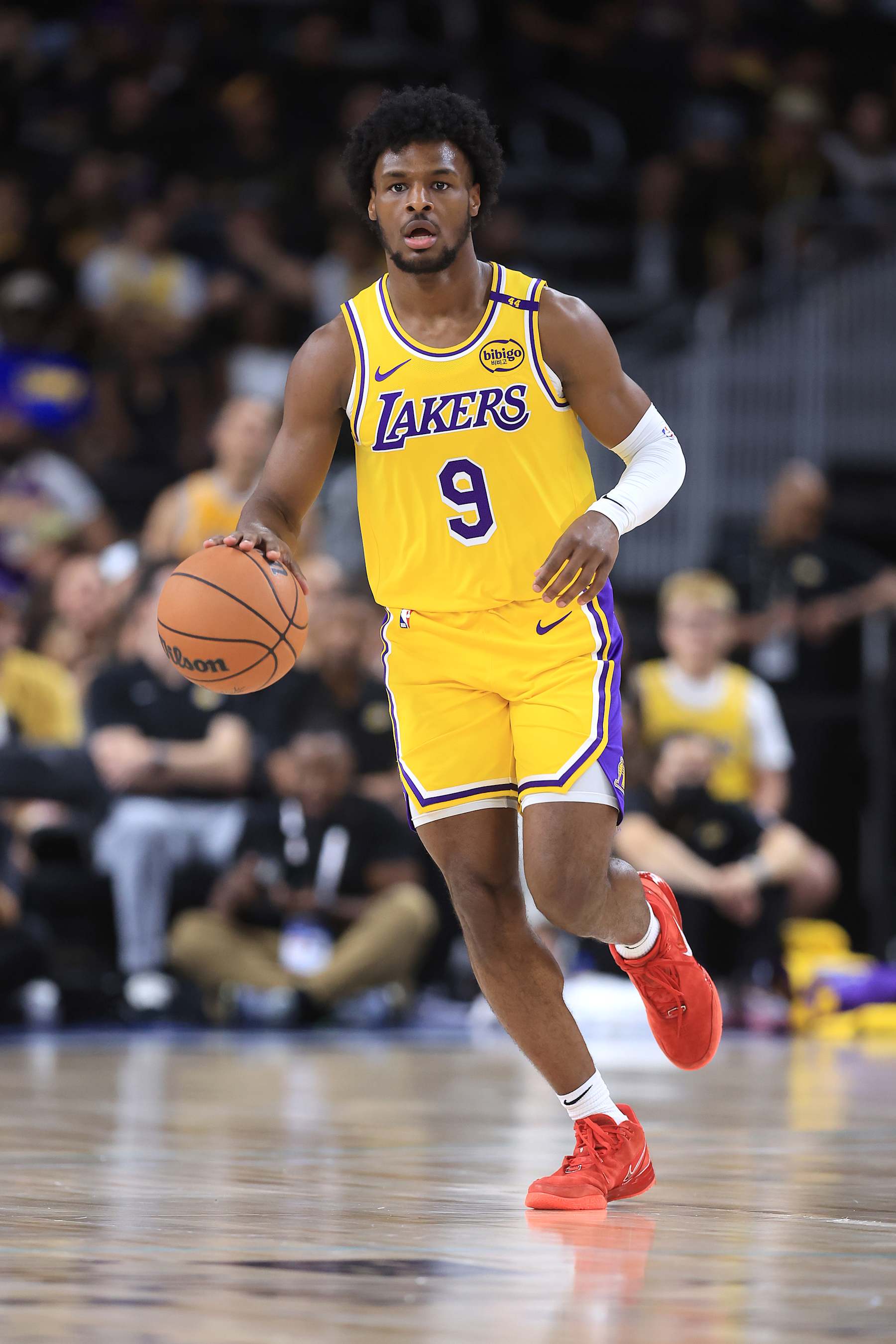 PALM SPRINGS, CALIFORNIA - OCTOBER 04: Bronny James #9 of the Los Angeles Lakers dribbles upcourt during the first half of a game against the Minnesota Timberwolves at Acrisure Arena on October 04, 2024 in Palm Springs, California.  (Photo by Sean M. Haffey/Getty Images)