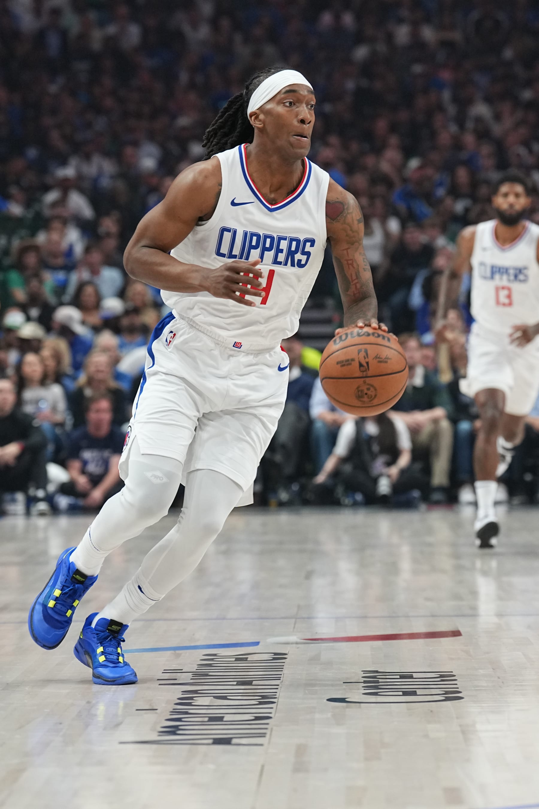 DALLAS, TX - MAY 3: Terance Mann #14 of the LA Clippers handles the ball during the game  against the Dallas Mavericks during Round 1 Game 6 of the 2024 NBA Playoffs  on May 3, 2024  at the American Airlines Center in Dallas, Texas. NOTE TO USER: User expressly acknowledges and agrees that, by downloading and or using this photograph, User is consenting to the terms and conditions of the Getty Images License Agreement. Mandatory Copyright Notice: Copyright 2024 NBAE (Photo by Glenn James/NBAE via Getty Images)
