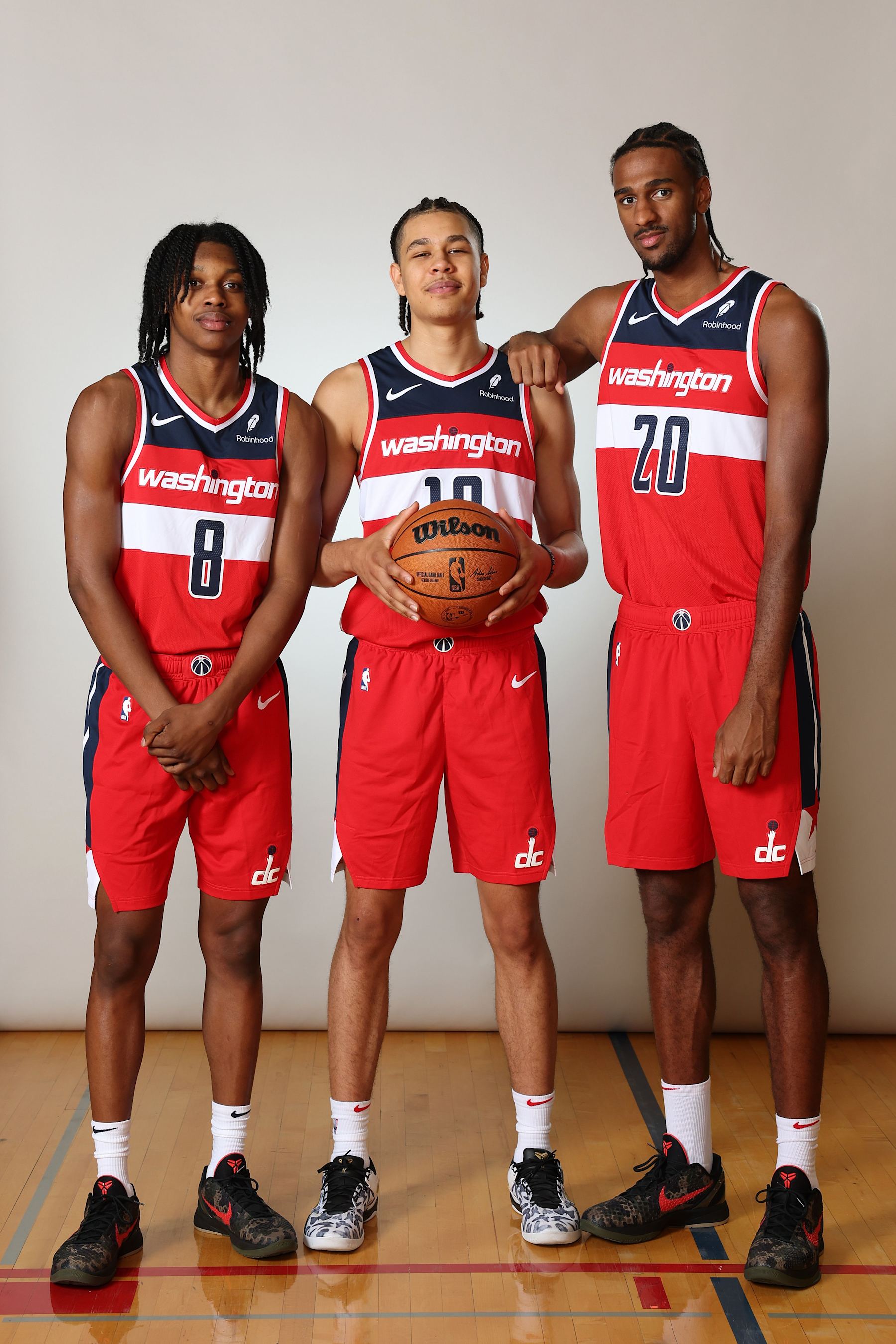 LAS VEGAS, NEVADA - JULY 17: (L-R) Carlton Carrington #17 of the Washington Wizards, Kyshawn George #18 of the Washington Wizards and Alexandre Sarr #12 of the Washington Wizards pose for a portrait during the 2024 NBA Rookie Photo Shoot at UNLV on July 17, 2024 in Las Vegas, Nevada.  (Photo by Monica Schipper/Getty Images)