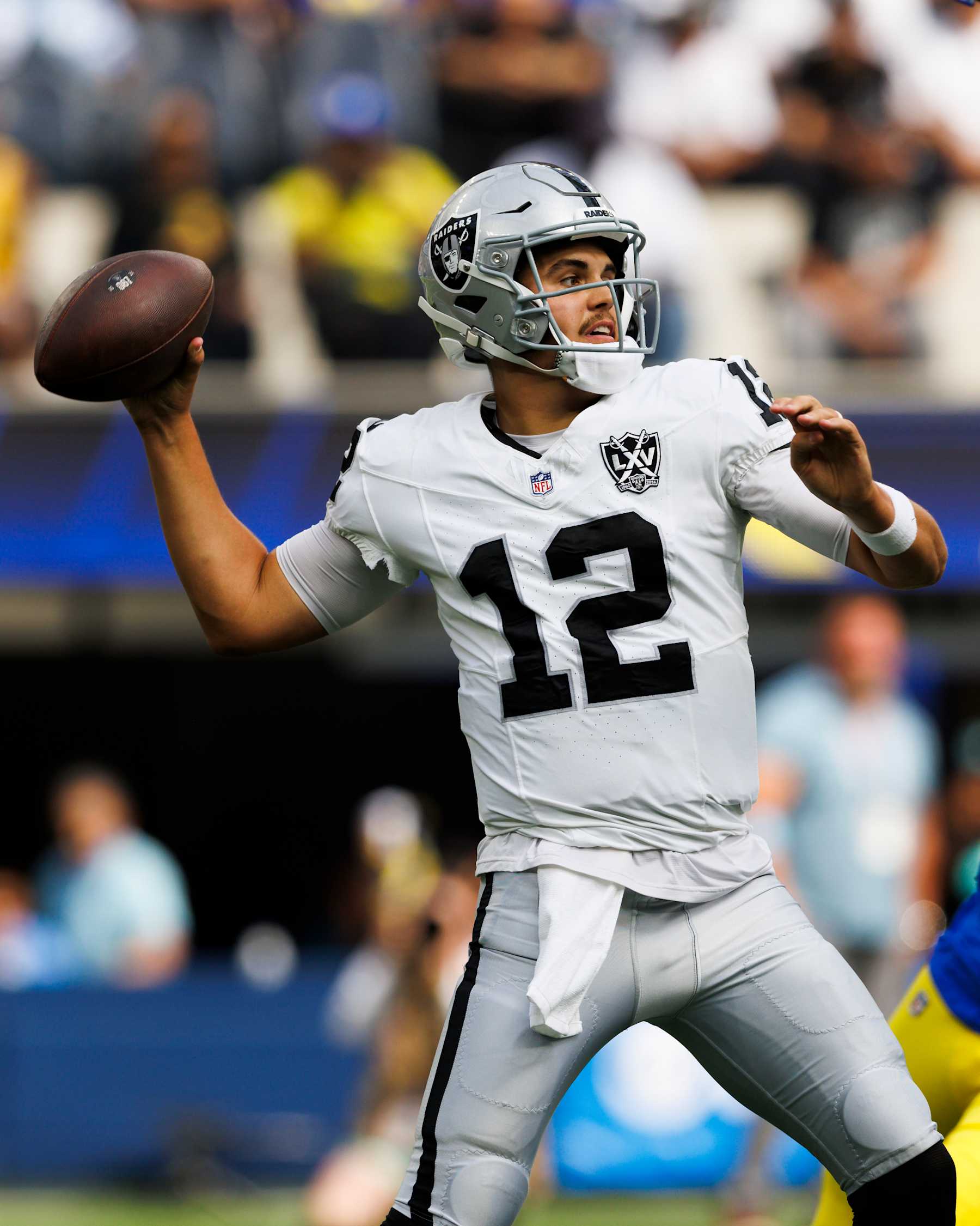 INGLEWOOD, CALIFORNIA - OCTOBER 20: Aidan O'Connell #12 of the Las Vegas Raiders throws during the first half against Los Angeles Rams at SoFi Stadium on October 20, 2024 in Inglewood, California. (Photo by Ric Tapia/Getty Images)