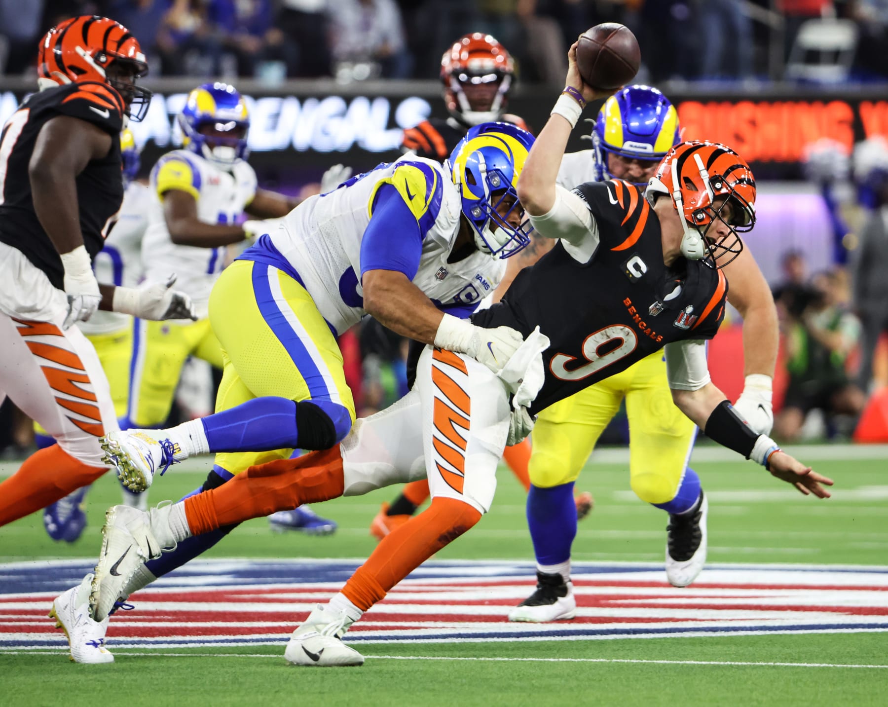 Inglewood, CA - February 13: Los Angeles Rams defensive end Aaron Donald (99) sacks Cincinnati Bengals quarterback Joe Burrow (9) near the end of in Super Bowl LVI at SoFi Stadium on Sunday, Feb. 13, 2022 in Inglewood, CA.(Robert Gauthier / Los Angeles Times via Getty Images)
