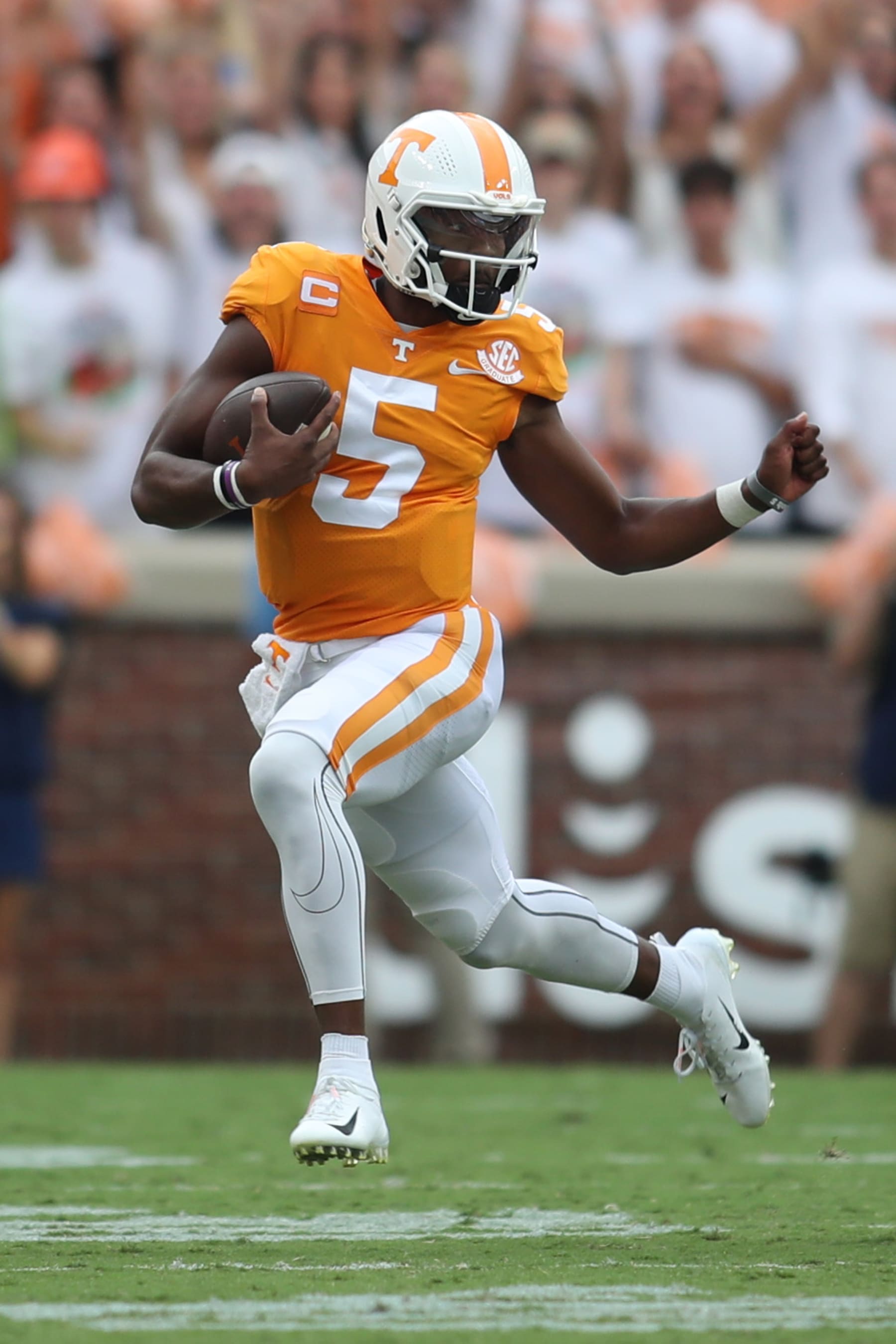 KNOXVILLE, TENNESSEE - SEPTEMBER 24: Hendon Hooker #5 of the Tennessee Volunteers runs the ball against the Florida Gators at Neyland Stadium on September 24, 2022 in Knoxville, Tennessee. Tennessee won the game 38-33. (Photo by Donald Page/Getty Images)