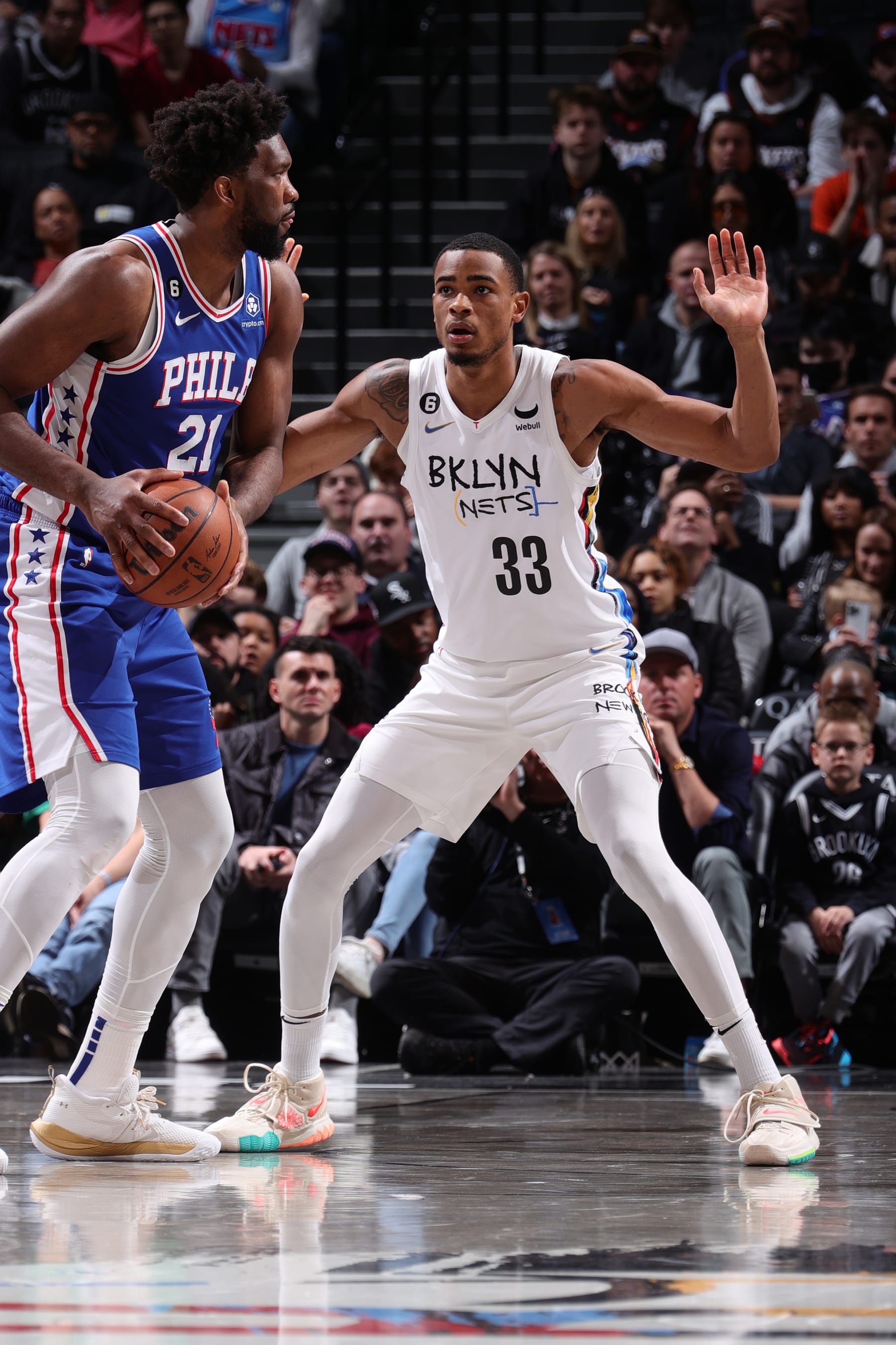 BROOKLYN, NY - FEBRUARY 11: Nicolas Claxton #33 of the Brooklyn Nets plays defense during the game on Joel Embiid #21 of the Philadelphia 76ers on February 11, 2023 at Barclays Center in Brooklyn, New York. NOTE TO USER: User expressly acknowledges and agrees that, by downloading and or using this Photograph, user is consenting to the terms and conditions of the Getty Images License Agreement. Mandatory Copyright Notice: Copyright 2023 NBAE (Photo by Nathaniel S. Butler/NBAE via Getty Images)