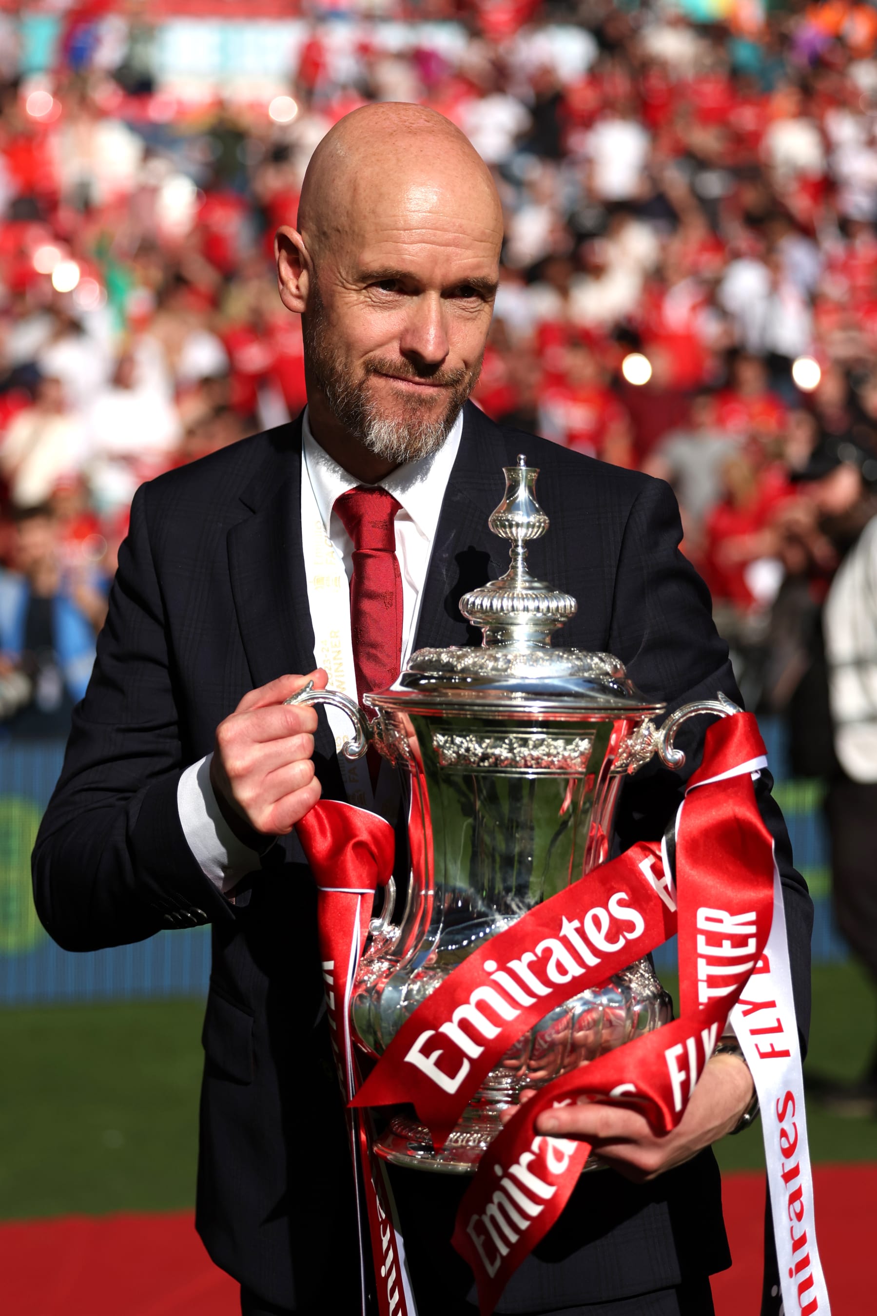 LONDON, ENGLAND - MAY 25: Erik ten Hag, Manager of Manchester United, poses for a photograph with the Emirates FA Cup Trophy after his team's victory in the Emirates FA Cup Final match between Manchester City and Manchester United at Wembley Stadium on May 25, 2024 in London, England. (Photo by Eddie Keogh - The FA/The FA via Getty Images)