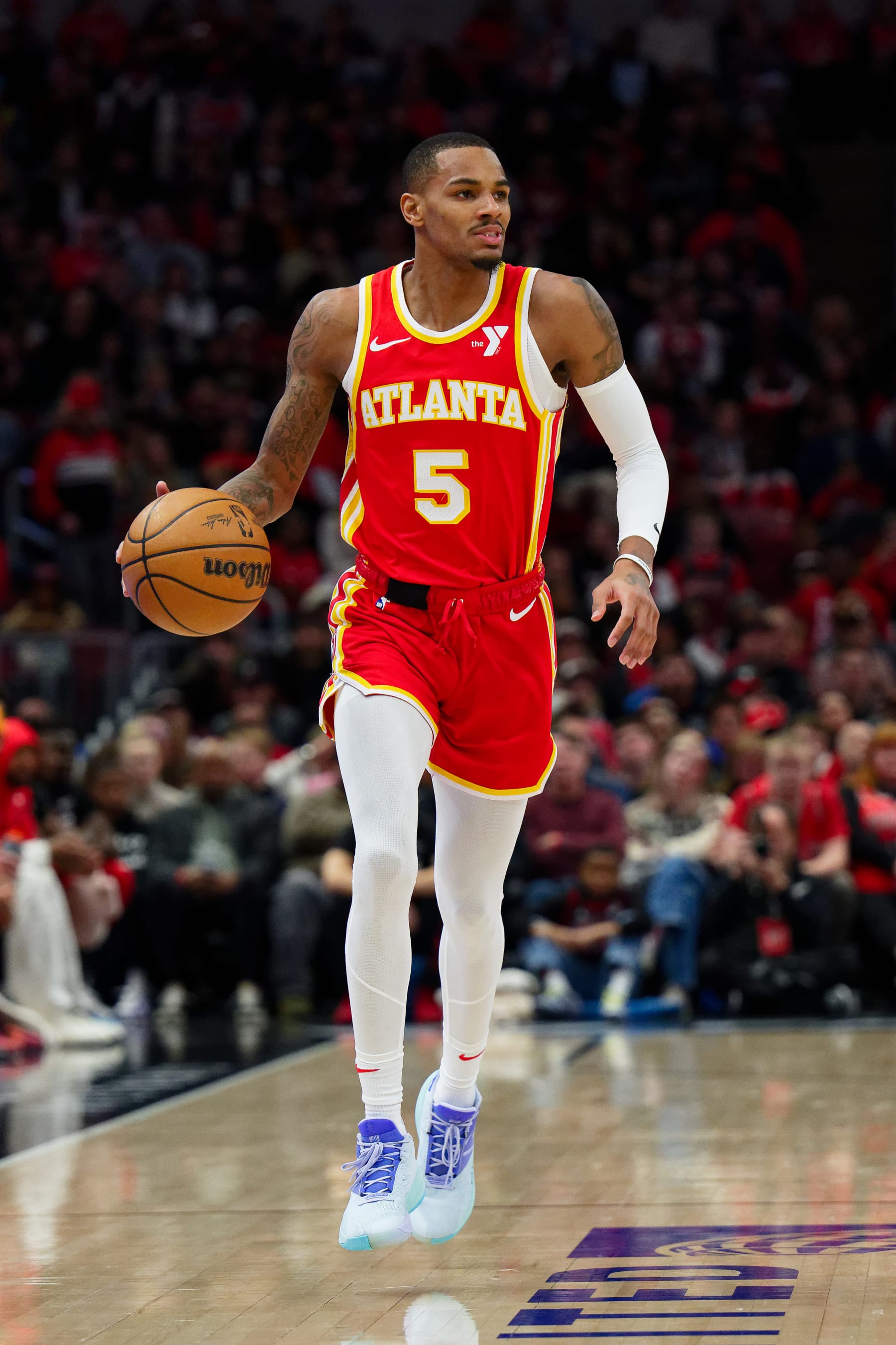 CHICAGO, ILLINOIS - DECEMBER 26:  Dejounte Murray #5 of the Atlanta Hawks controls the ball against the Chicago Bulls on December 26, 2023 at United Center in Chicago, Illinois.  NOTE TO USER: User expressly acknowledges and agrees that, by downloading and or using this photograph, User is consenting to the terms and conditions of the Getty Images License Agreement.  (Photo by Jamie Sabau/Getty Images)