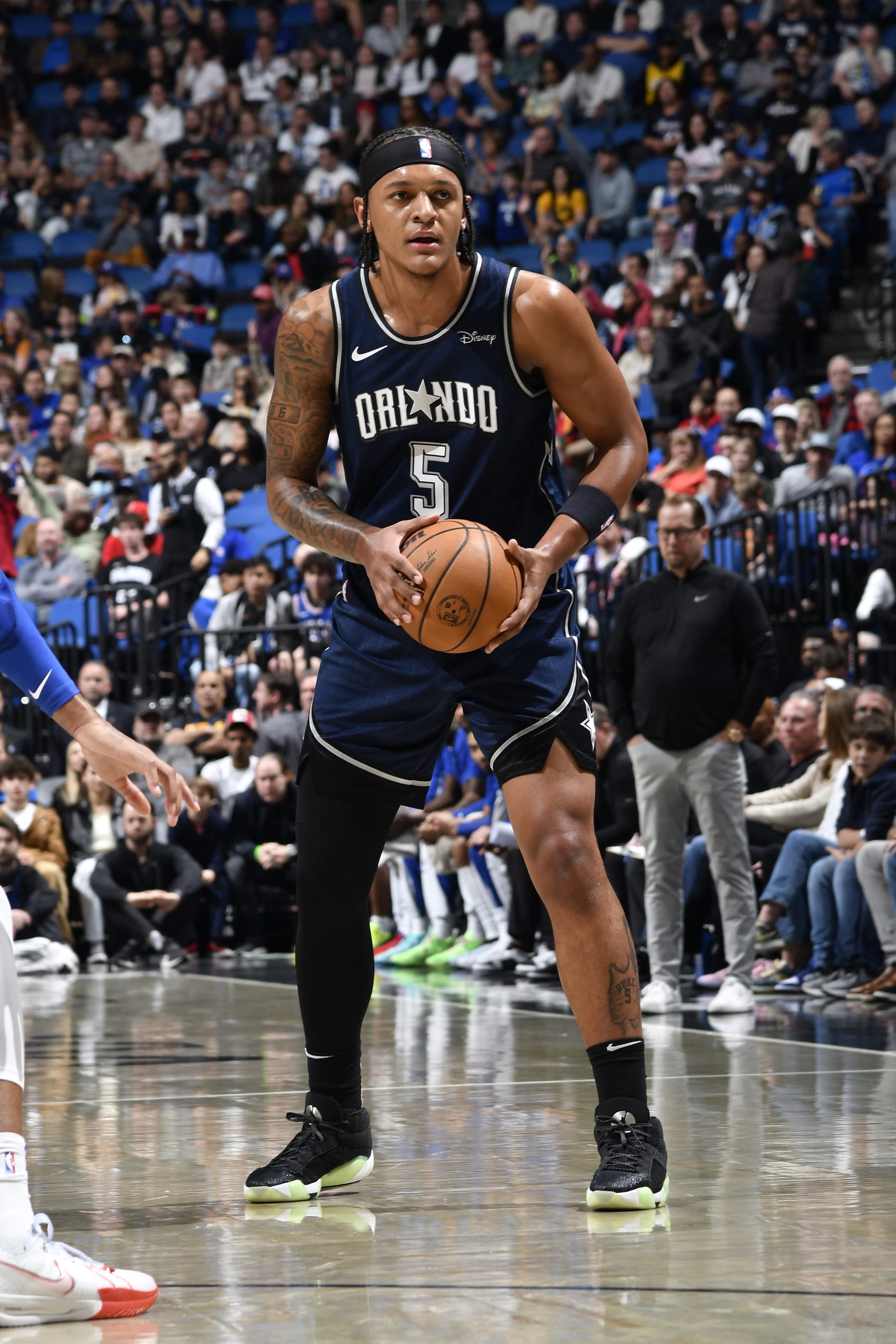 ORLANDO, FL - DECEMBER 27: Paolo Banchero #5 of the Orlando Magic looks to pass the ball during the game against the Philadelphia 76ers on December 27, 2023 at the Kia Center in Orlando, Florida. NOTE TO USER: User expressly acknowledges and agrees that, by downloading and or using this photograph, User is consenting to the terms and conditions of the Getty Images License Agreement. Mandatory Copyright Notice: Copyright 2023 NBAE (Photo by Fernando Medina/NBAE via Getty Images)