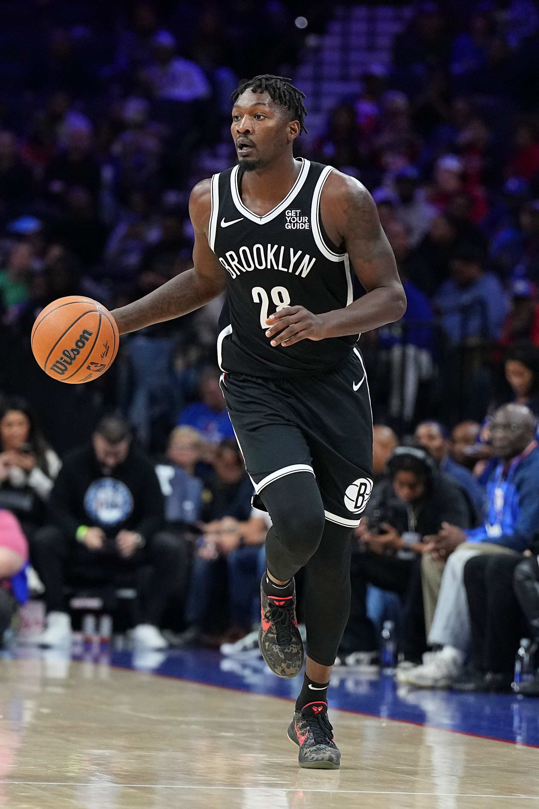 PHILADELPHIA, PENNSYLVANIA - OCTOBER 16: Dorian Finney-Smith #28 of the Brooklyn Nets dribbles the ball against the Philadelphia 76ers during the preseason game at the Wells Fargo Center on October 16, 2024 in Philadelphia, Pennsylvania. The 76ers defeated the Nets 117-95. NOTE TO USER: User expressly acknowledges and agrees that, by downloading and/or using this photograph, user is consenting to the terms and conditions of the Getty Images License Agreement. (Photo by Mitchell Leff/Getty Images)