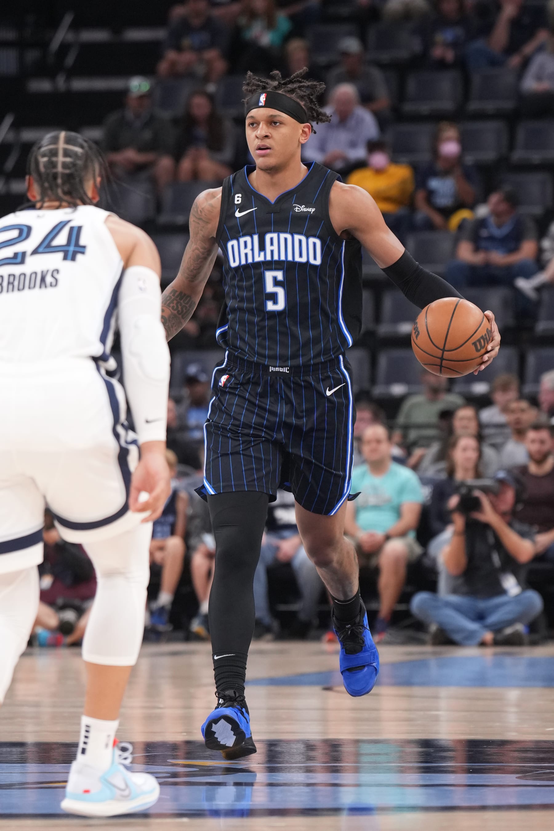 MEMPHIS, TN - OCTOBER 3: Paolo Banchero #5 of the Orlando Magic dribbles the ball against the Memphis Grizzlies during a preseason game on October 3, 2022 at FedExForum in Memphis, Tennessee. NOTE TO USER: User expressly acknowledges and agrees that, by downloading and or using this photograph, User is consenting to the terms and conditions of the Getty Images License Agreement. Mandatory Copyright Notice: Copyright 2022 NBAE (Photo by Jesse D. Garrabrant/NBAE via Getty Images)