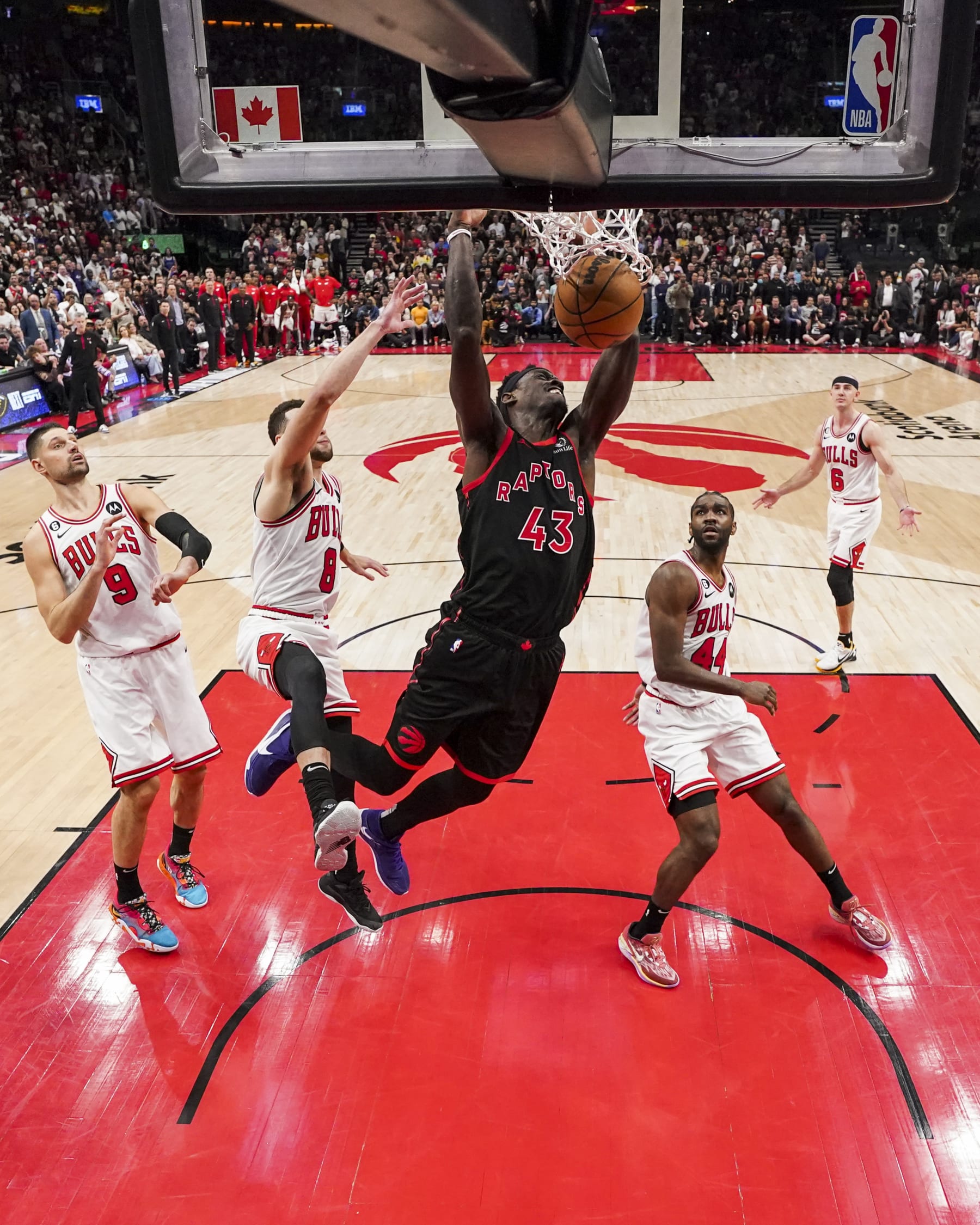 TORONTO, ON - APRIL 12: Pascal Siakam #43 of the Toronto Raptors dunks against Zach LaVine #8 of the Chicago Bulls during the 2023 Play-In Tournament at the Scotiabank Arena on April 12, 2023 in Toronto, Ontario, Canada. NOTE TO USER: User expressly acknowledges and agrees that, by downloading and/or using this Photograph, user is consenting to the terms and conditions of the Getty Images License Agreement. (Photo by Andrew Lahodynskyj/Getty Images)