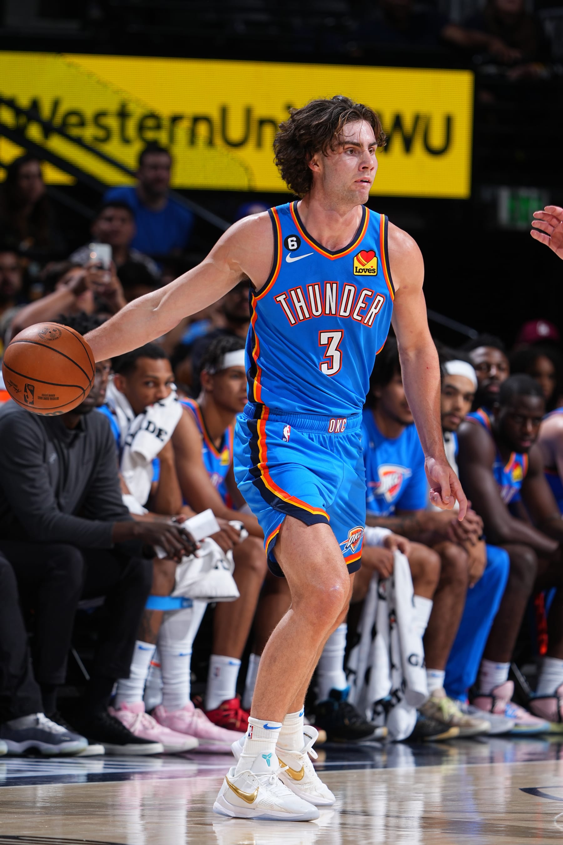 DENVER, CO - OCTOBER 3: Josh Giddey #3 of the Oklahoma City Thunder dribbles the ball during the game against the Denver Nuggets on October 3, 2022 at the Ball Arena in Denver, Colorado. NOTE TO USER: User expressly acknowledges and agrees that, by downloading and/or using this Photograph, user is consenting to the terms and conditions of the Getty Images License Agreement. Mandatory Copyright Notice: Copyright 2022 NBAE (Photo by Garrett Ellwood/NBAE via Getty Images)