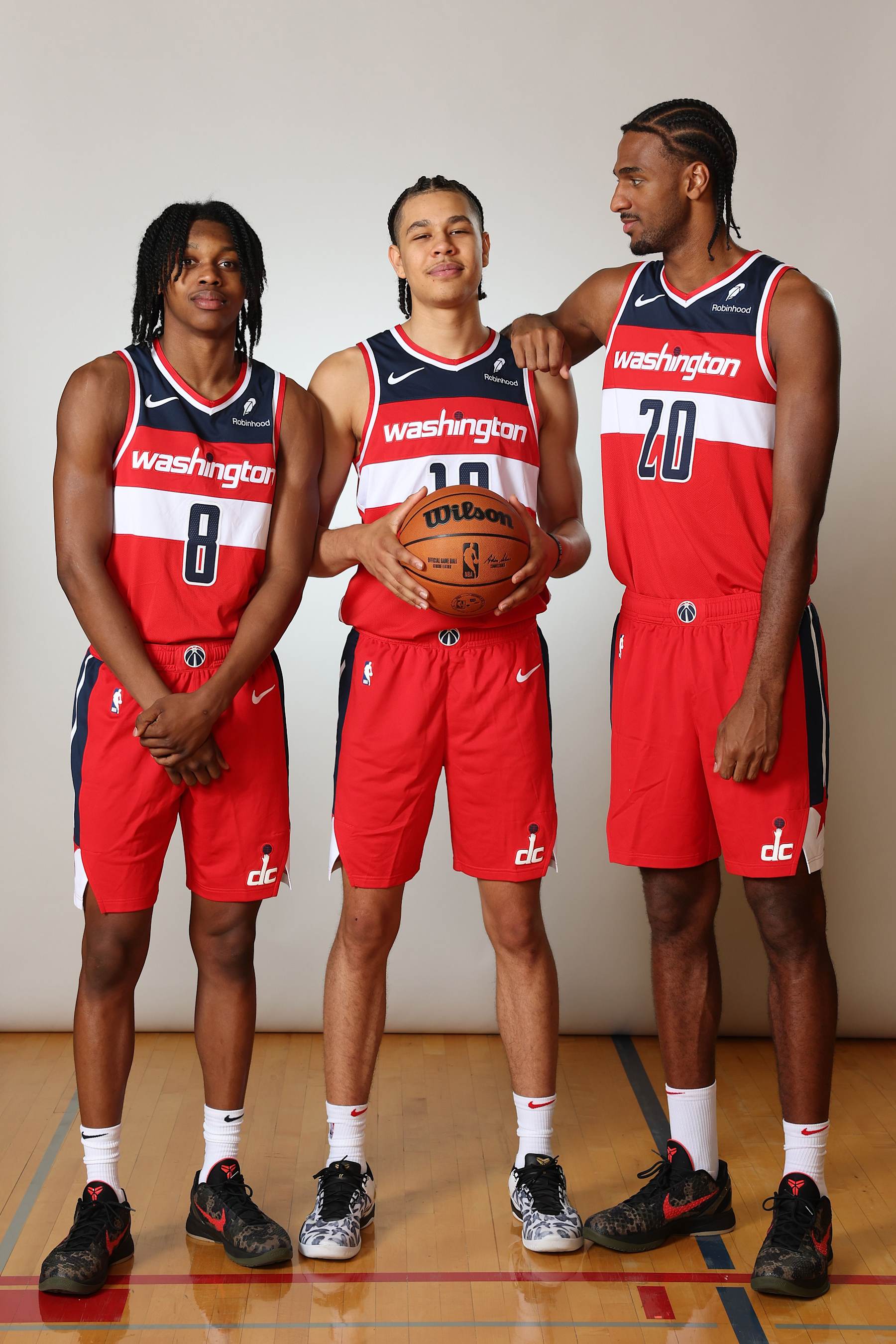 LAS VEGAS, NEVADA - JULY 17: (L-R) Carlton Carrington #17 of the Washington Wizards, Kyshawn George #18 of the Washington Wizards and Alexandre Sarr #12 of the Washington Wizards pose for a portrait during the 2024 NBA Rookie Photo Shoot at UNLV on July 17, 2024 in Las Vegas, Nevada.  (Photo by Monica Schipper/Getty Images)