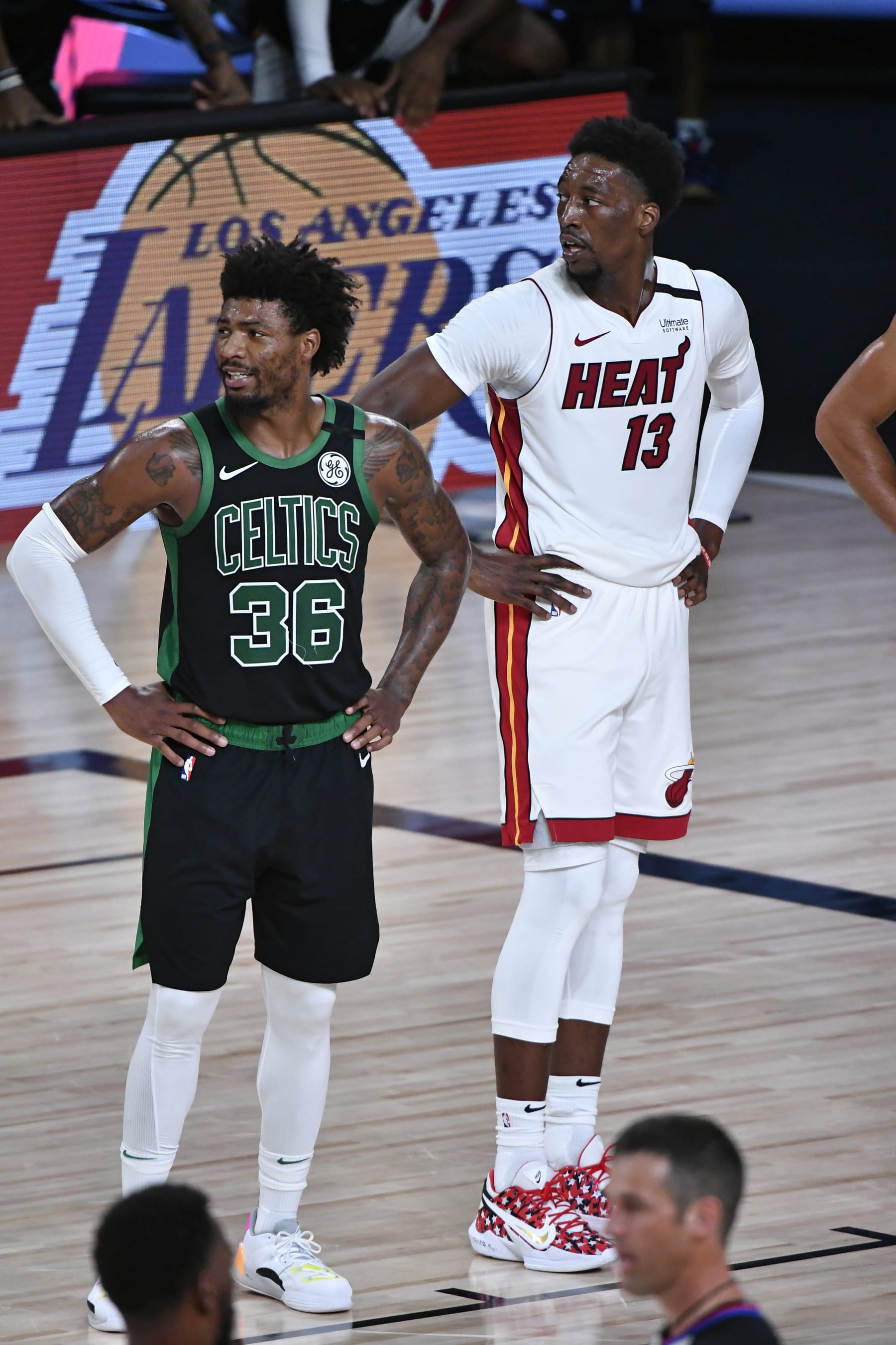 ORLANDO, FL - SEPTEMBER 25: Marcus Smart #36 of the Boston Celtics and Bam Adebayo #13 of the Miami Heat look on during Game Five of the Eastern Conference Finals of the NBA Playoffs on September 25, 2020 at the AdventHealth Arena at ESPN Wide World Of Sports Complex in Orlando, Florida. NOTE TO USER: User expressly acknowledges and agrees that, by downloading and/or using this Photograph, user is consenting to the terms and conditions of the Getty Images License Agreement. Mandatory Copyright Notice: Copyright 2020 NBAE (Photo by Fernando Medina/NBAE via Getty Images)