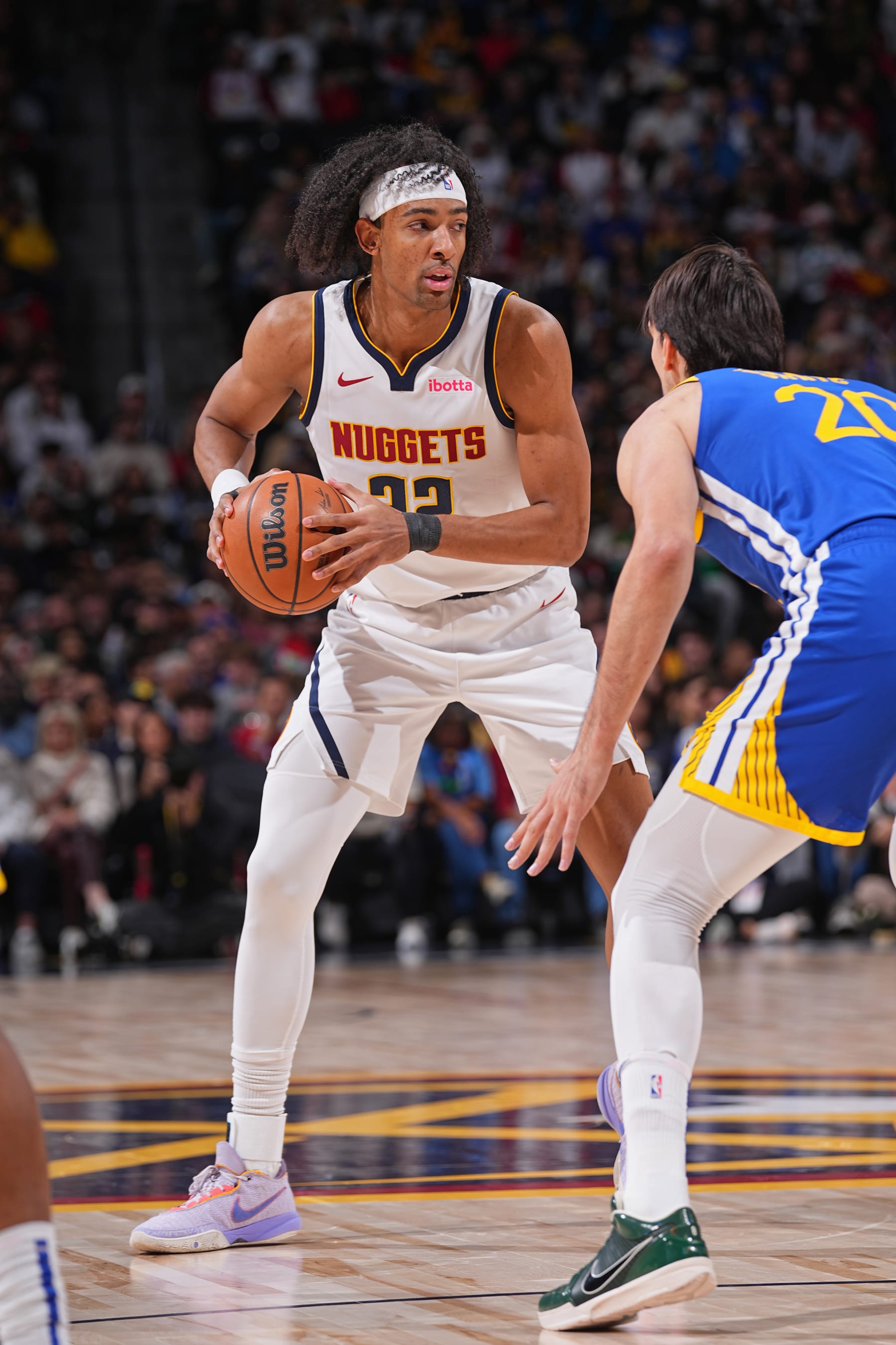 DENVER, CO - DECEMBER 25: Zeke Nnaji #22 of the Denver Nuggets looks on during the game against the Golden State Warriors on December 25, 2023 at the Ball Arena in Denver, Colorado. NOTE TO USER: User expressly acknowledges and agrees that, by downloading and/or using this Photograph, user is consenting to the terms and conditions of the Getty Images License Agreement. Mandatory Copyright Notice: Copyright 2023 NBAE (Photo by Bart Young/NBAE via Getty Images)