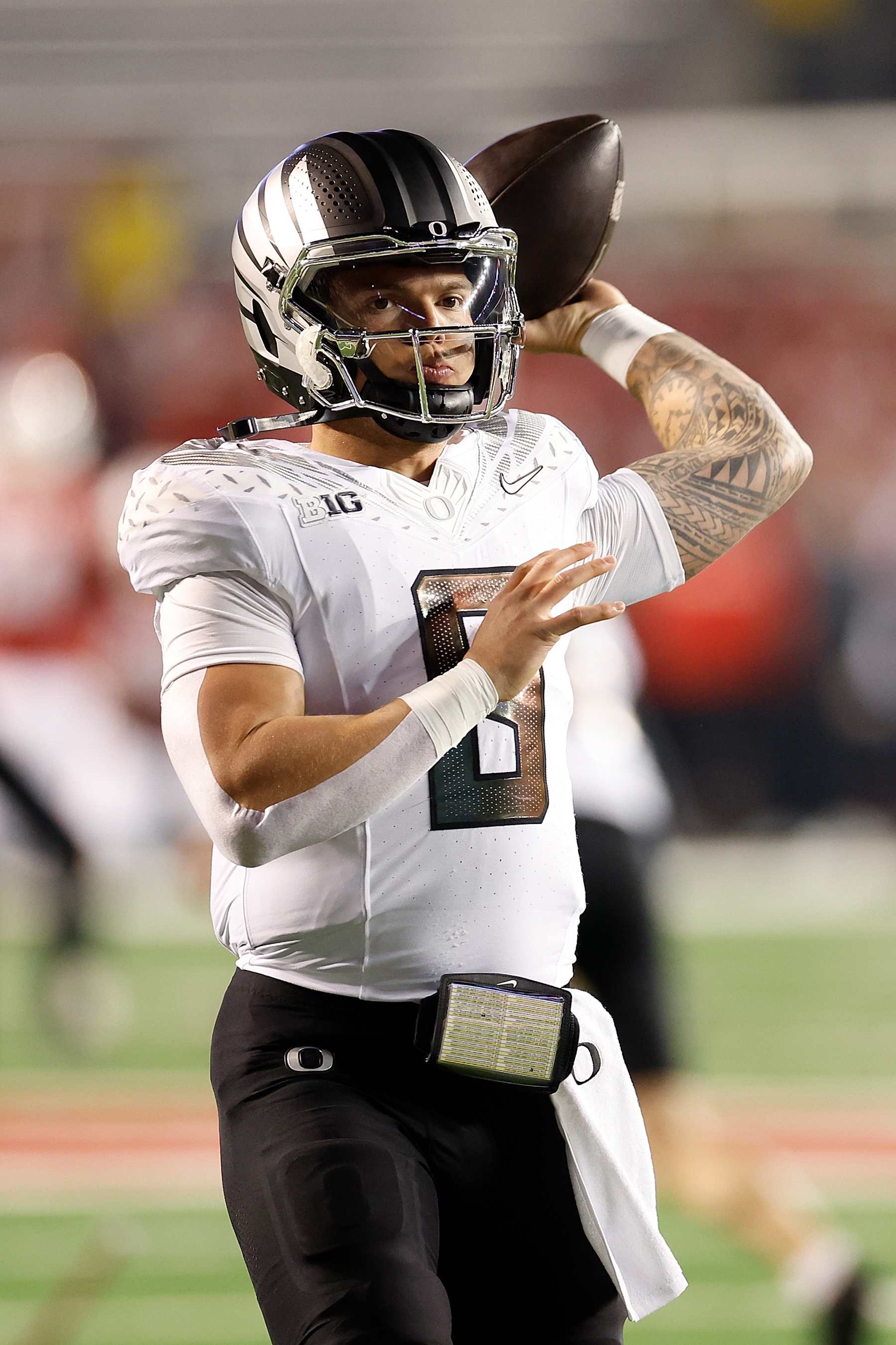 MADISON, WISCONSIN - NOVEMBER 16: Dillon Gabriel #8 of the Oregon Ducks warms up before game against the Wisconsin Badgers at Camp Randall Stadium on November 16, 2024 in Madison, Wisconsin. (Photo by John Fisher/Getty Images)