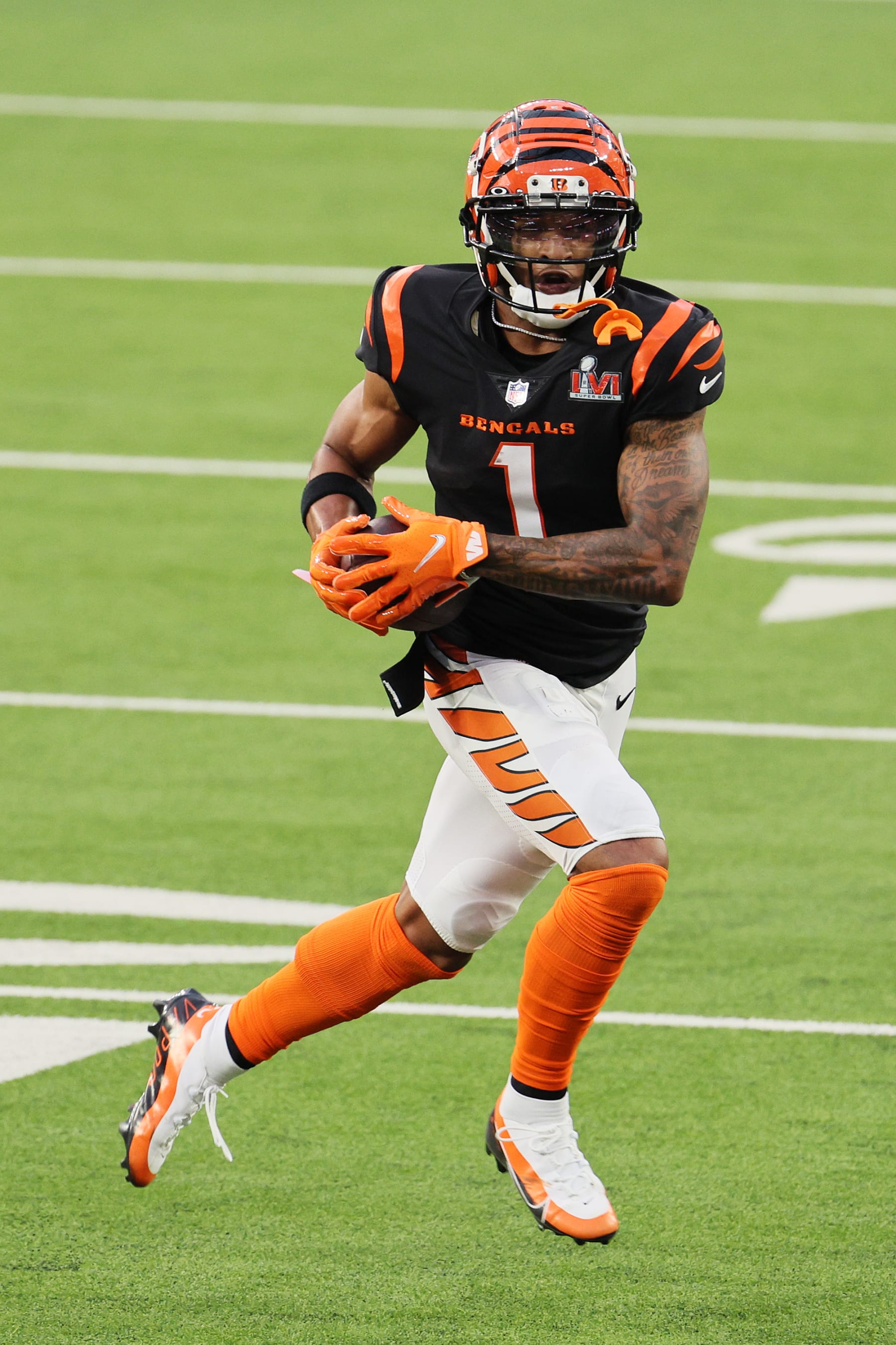 INGLEWOOD, CALIFORNIA - FEBRUARY 13: Ja'Marr Chase #1 of the Cincinnati Bengals runs with the ball during Super Bowl LVI at SoFi Stadium on February 13, 2022 in Inglewood, California. The Los Angeles Rams defeated the Cincinnati Bengals 23-20.  (Photo by Andy Lyons/Getty Images)