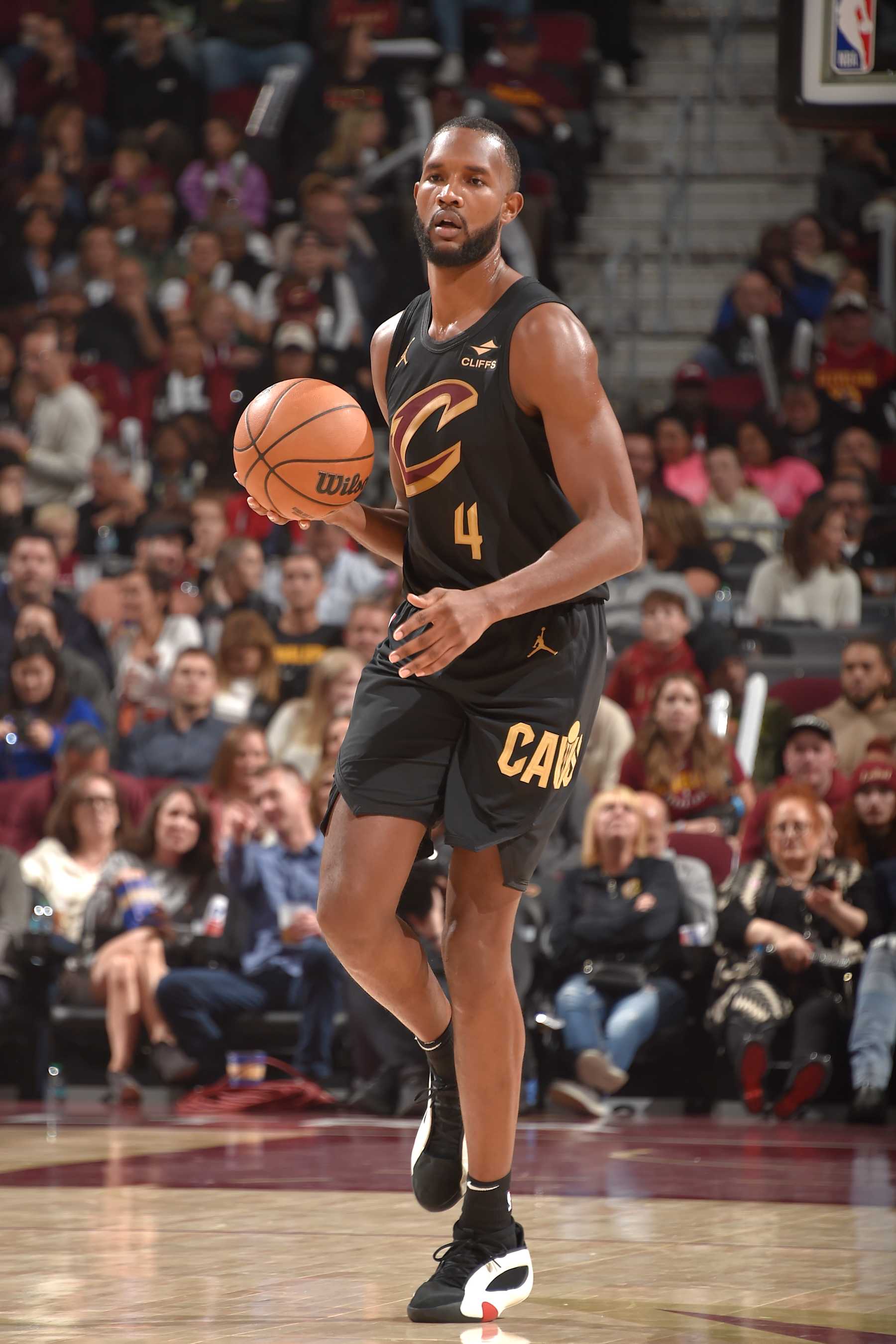 CLEVELAND, OH - NOVEMBER 1: Evan Mobley #4 of the Cleveland Cavaliers brings the ball up court during the game against the Orlando Magic on November 1, 2024 at Rocket Mortgage FieldHouse in Cleveland, Ohio. NOTE TO USER: User expressly acknowledges and agrees that, by downloading and/or using this Photograph, user is consenting to the terms and conditions of the Getty Images License Agreement. Mandatory Copyright Notice: Copyright 2024 NBAE (Photo by David Liam Kyle/NBAE via Getty Images)