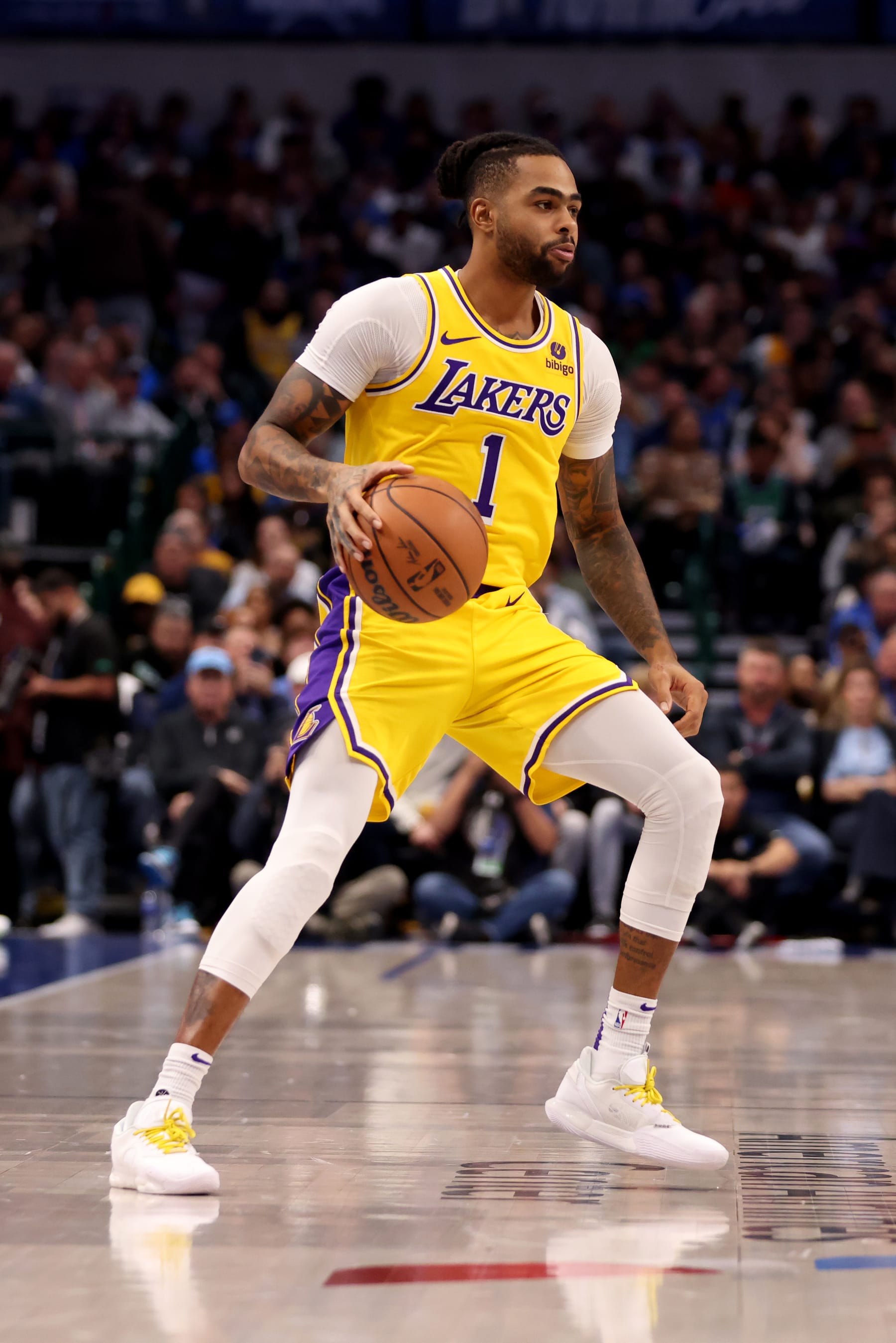 DALLAS, TEXAS - DECEMBER 12: D'Angelo Russell #1 of the Los Angeles Lakers dribbles the ball up court against the Dallas Mavericks in the first half at American Airlines Center on December 12, 2023 in Dallas, Texas. NOTE TO USER: User expressly acknowledges and agrees that, by downloading and or using this photograph, User is consenting to the terms and conditions of the Getty Images License Agreement. (Photo by Tim Heitman/Getty Images)