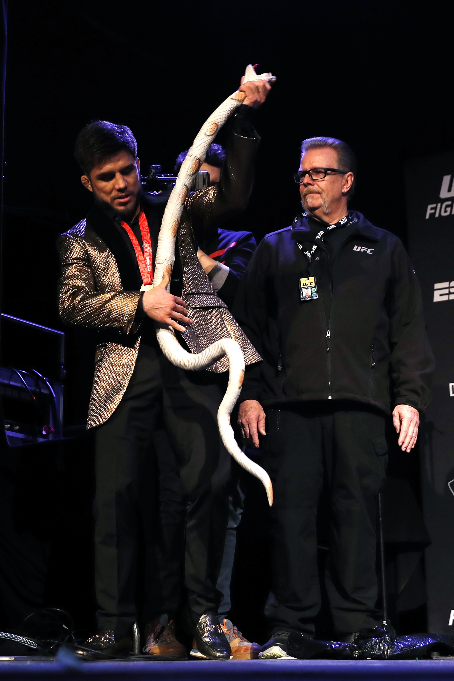 NEW YORK, NEW YORK - JANUARY 17: Henry Cejudo holds opens the gift from TJ Dillashaw during the press conference ahead of UFC Fight Night Cejudo v Dillashaw at the Music Hall of Williamsburg on January 17, 2019 in the Brooklyn borough of New York City. (Photo by Michael Owens/Zuffa LLC/Zuffa LLC)