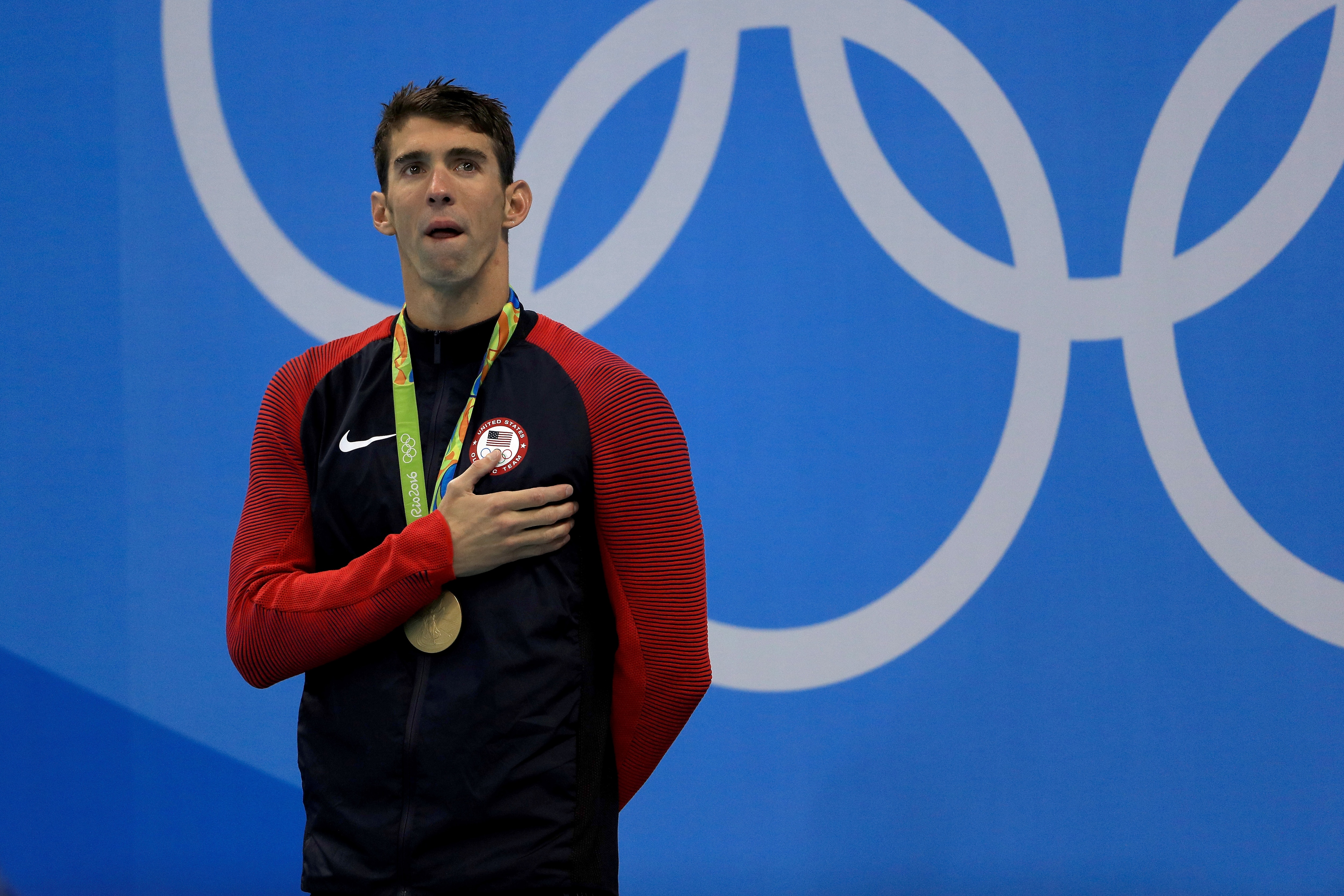 RIO DE JANEIRO, BRAZIL - AUGUST 11:  Gold medalist Michael Phelps of the United States poses on the podium during the medal ceremony for the Men's 200m Individual Medley Final on Day 6 of the Rio 2016 Olympic Games at the Olympic Aquatics Stadium on August 11, 2016 in Rio de Janeiro, Brazil.  (Photo by Mike Ehrmann/Getty Images)