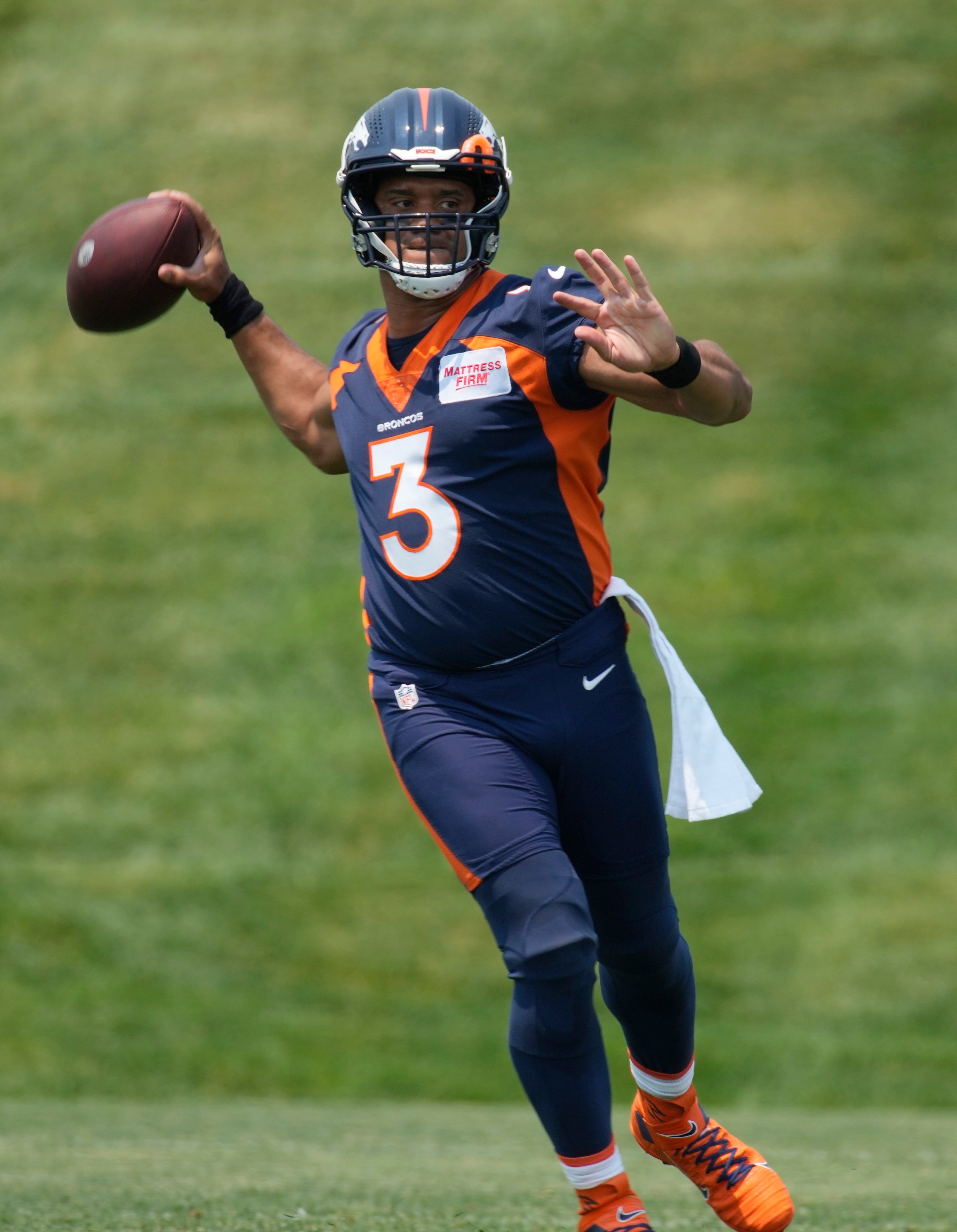 Denver Broncos quarterback Russell Wilson (3) takes part in drills during the NFL team's practice at the Broncos' headquarters Monday, June 13, 2022, in Centennial, Colo. (AP Photo/David Zalubowski)